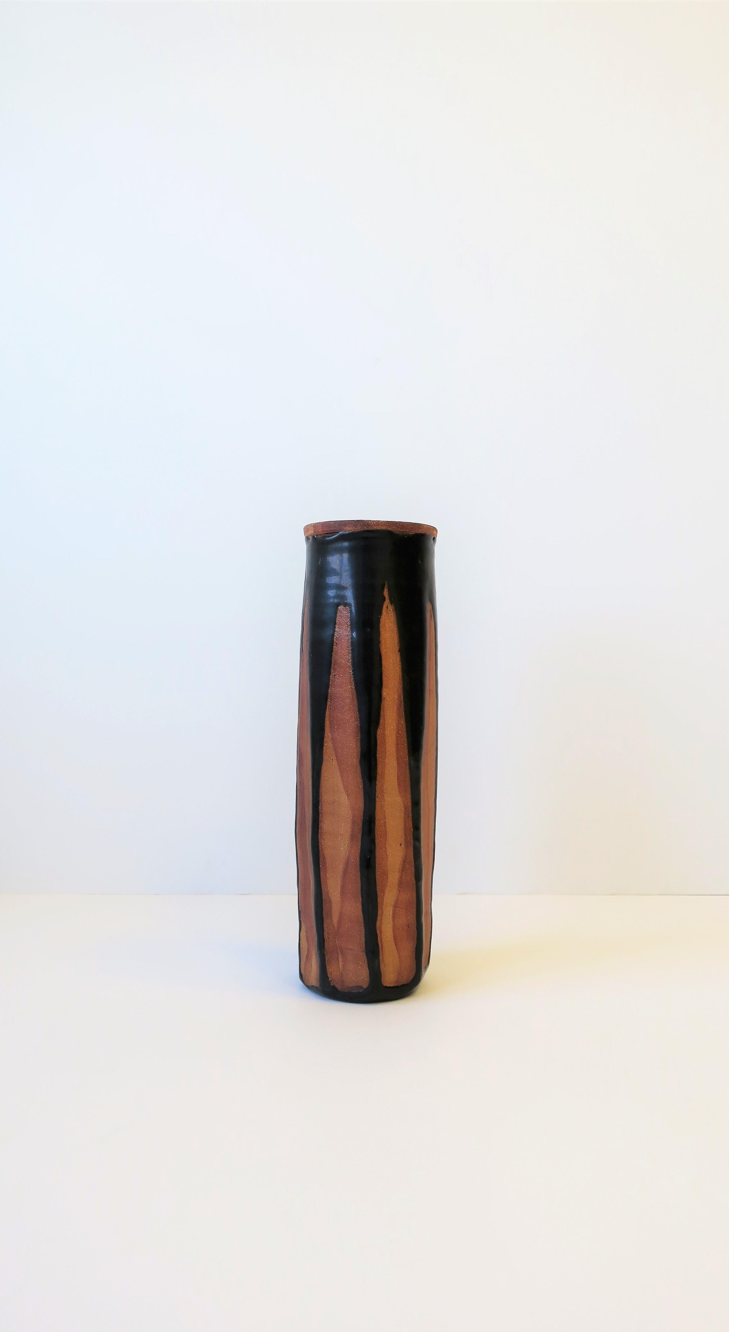 A beautiful black and terracotta studio pottery vase with octagonal design, circa 1960s-1970s. Vase is signed on bottom as show in image #11. 

Vase measures: 3.5