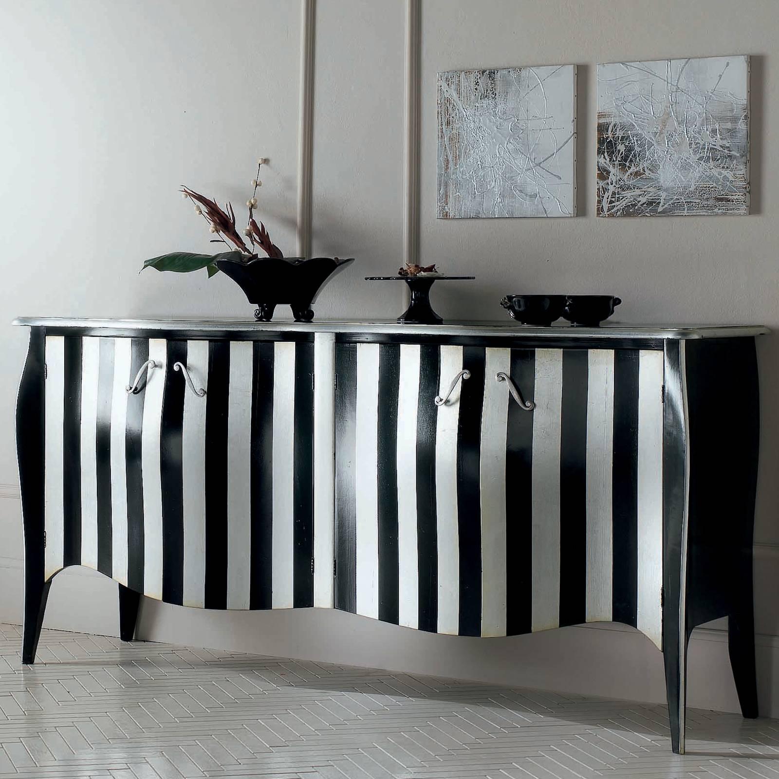 This elegant sideboard with four doors boasts a bold silhouette and sharp lines. The three-dimensional facade, complete with sinuous surface and scalloped lower edge, is accented by the striped black and white lines, effortlessly flowing into one