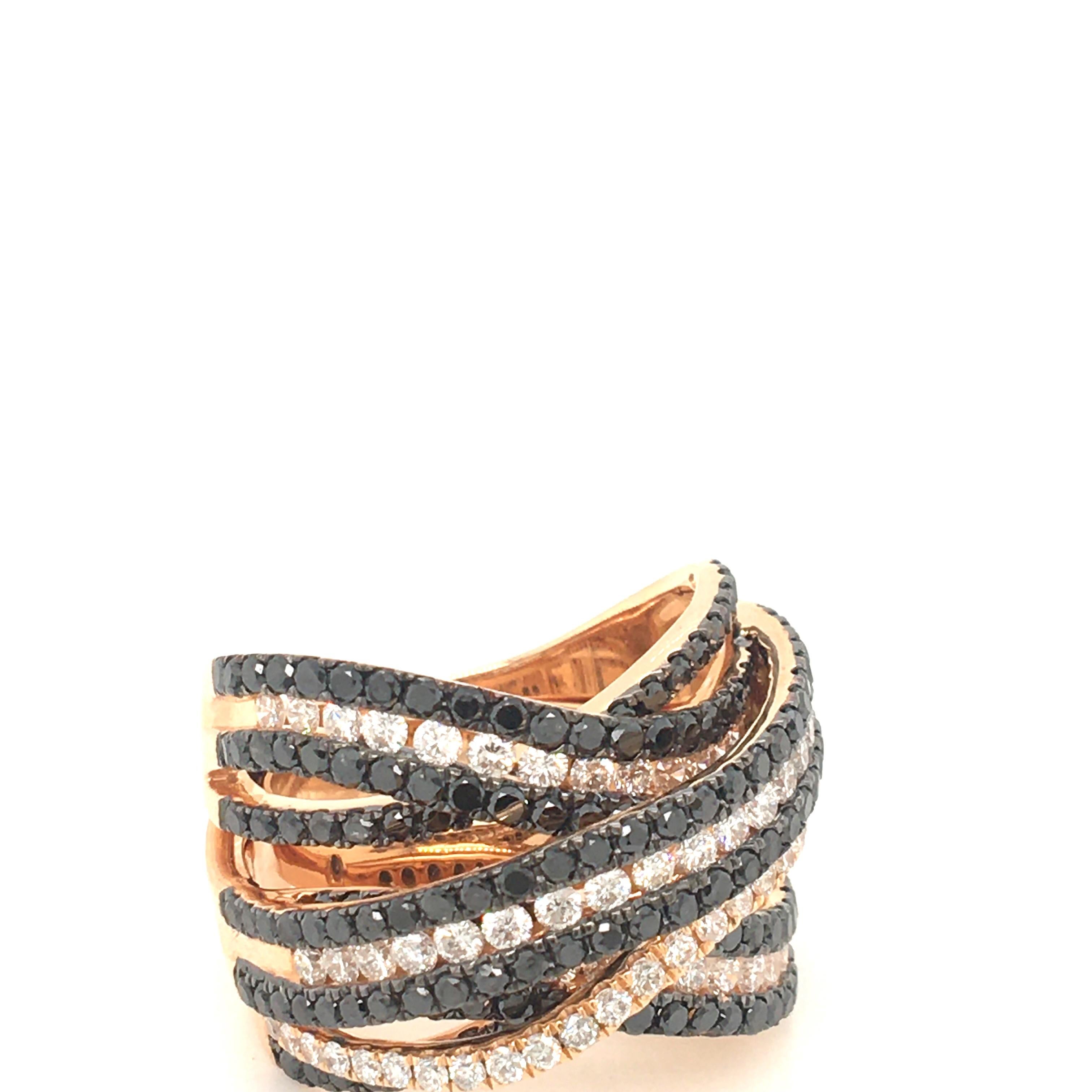 18 KT rose gold  dome ring set with white diamonds carats 1.43 color G 
clarity  VS and black diamonds Carats 2.82, woven design
Made In Italy comes in a Box
finger size 13 Italian size