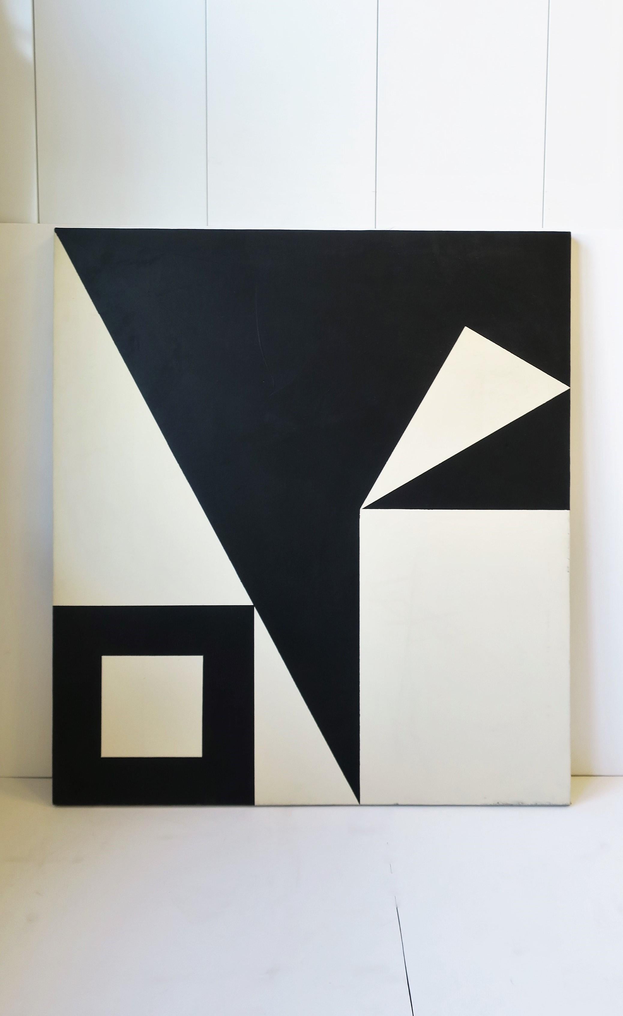 A beautiful, relatively large, black and white (off-white) abstract geometric artwork, oil or acrylic paint, on a hand-stretched canvas, circa mid to late-20th century. Artwork is unsigned, but in the style of Ellsworth Kelly. Piece is prepared for