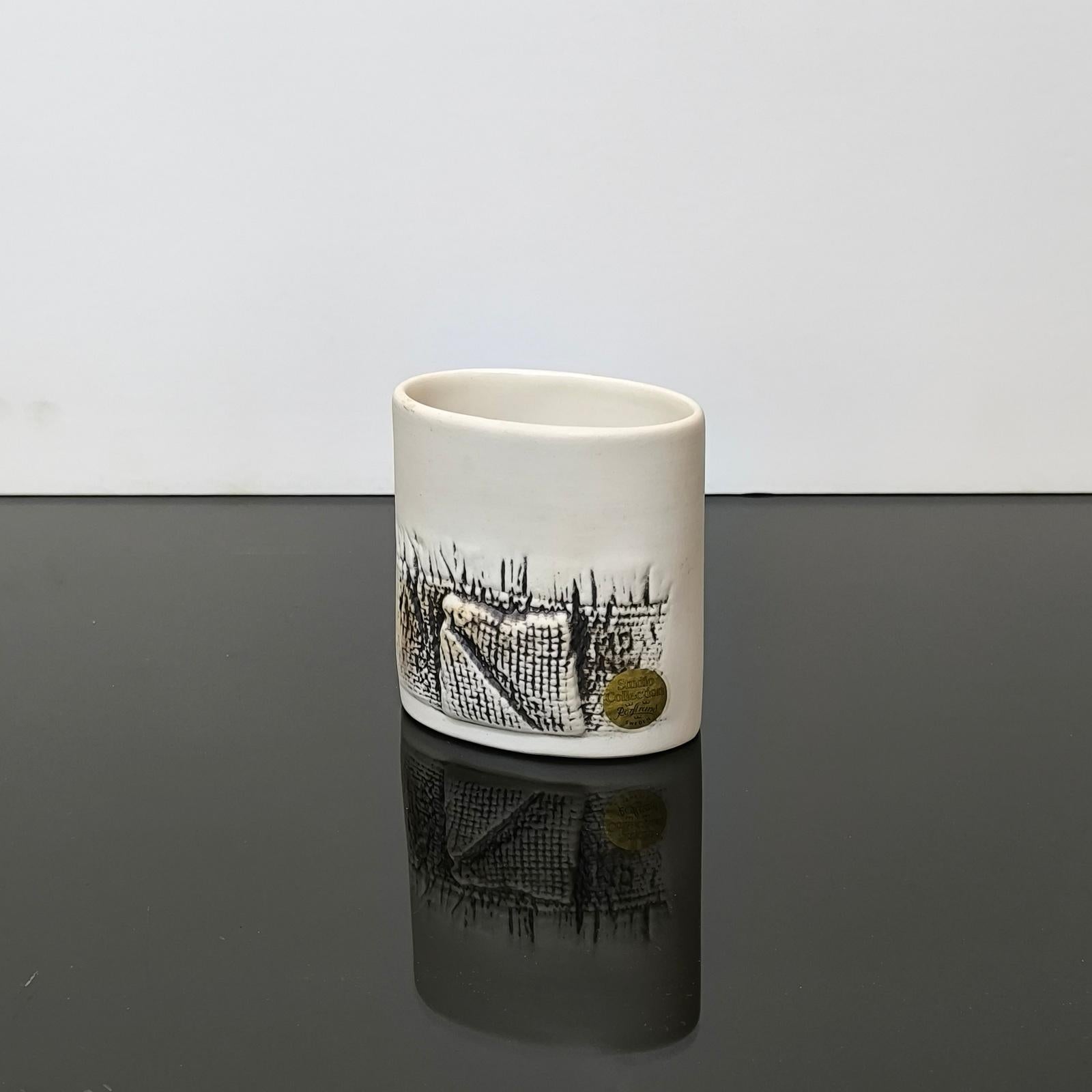 Suzanne Öhlén (1985) stoneware vase, white clay, and relief decor. Designed in the 1980s at the Rörstrand company. An era-typical Swedish art piece!
Dimensions: 8.5x5.5x9cm
Maker's mark and artist signature on the bottom. Original manufacturer label