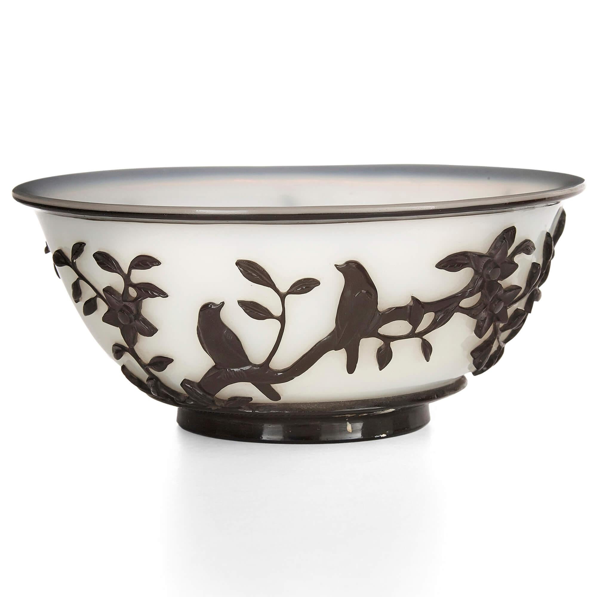 Black and white Chinese Peking glass bowl
Chinese, 20th century
Measures: Height 7cm, diameter 16cm

This beautiful bowl is crafted from Peking glass, a traditional Chinese technique whereby one layer of coloured glass is laid over another layer