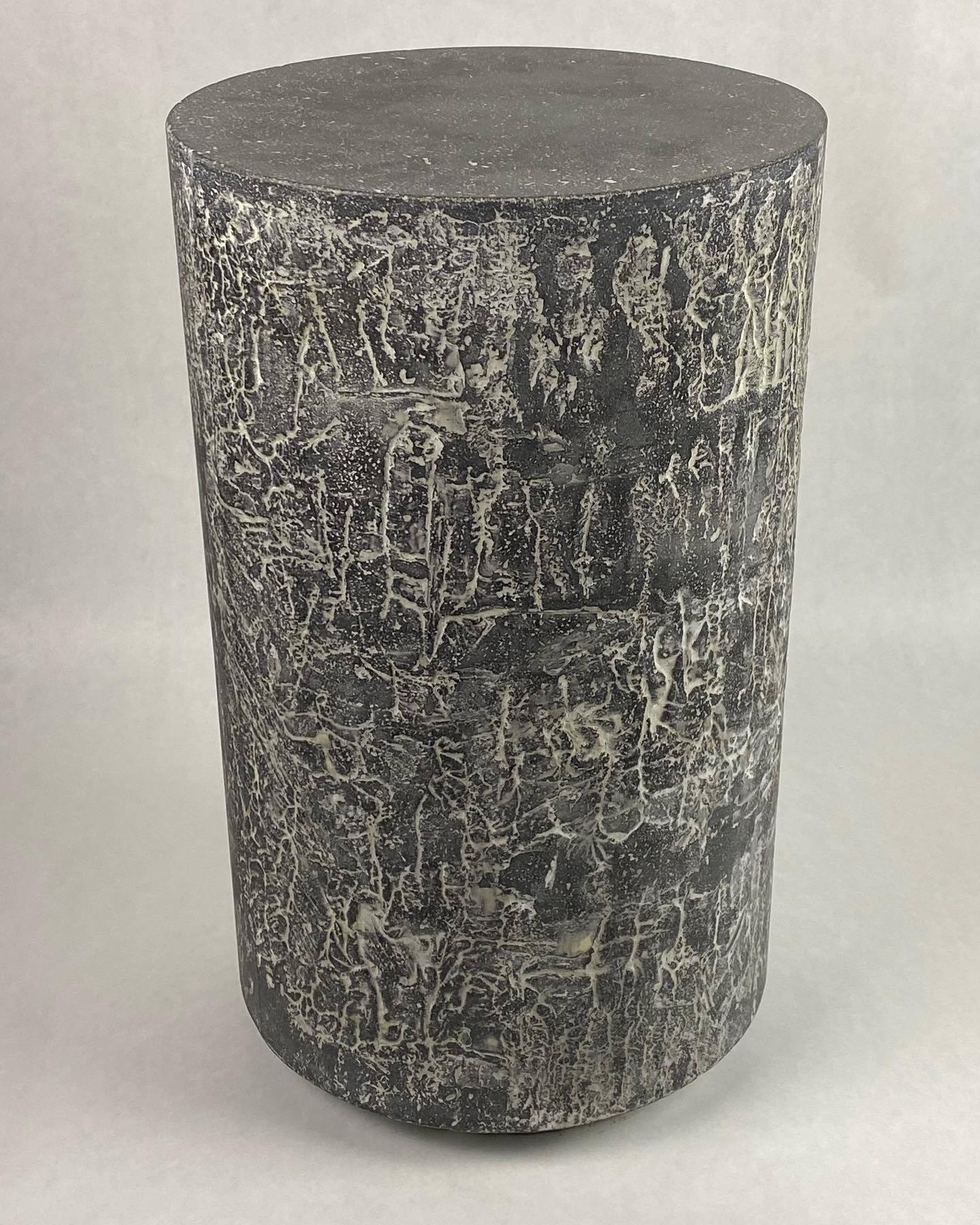 One of a kind, artistic concrete side or end table with textured black and white sides. Abstract line patterning on sides evoke an ancient script. Handpacked concrete made with Glass Fiber Reinforced Concrete techniques and recycled glass. Weighs
