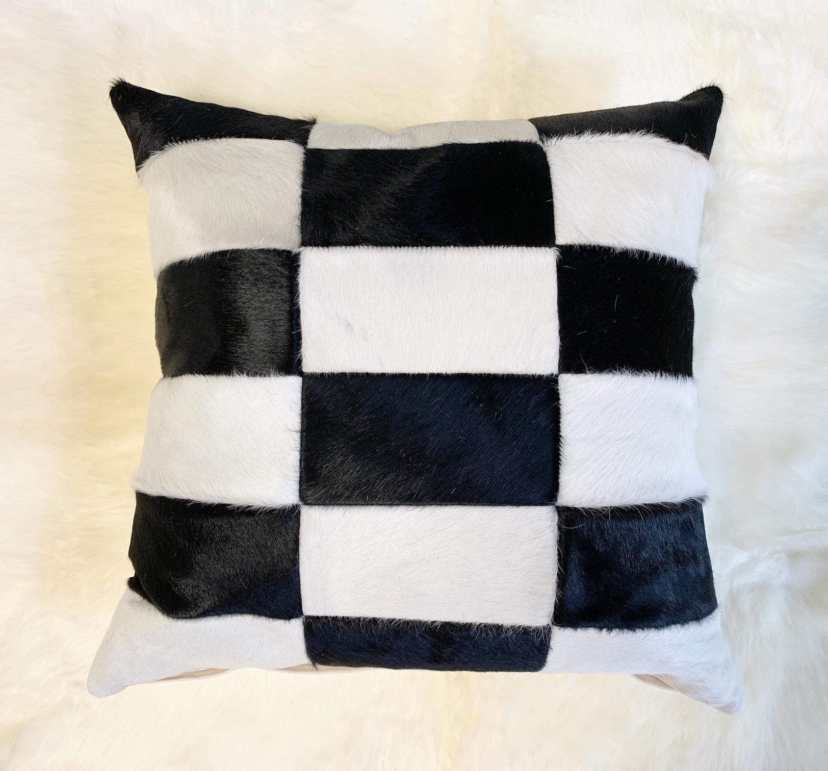 Forsyth cowhide pillows are simply the best. The most beautiful cowhides are selected, handcut, handstitched, and hand stuffed with the finest feather insert. These are finished with a cotton canvas back in ivory colorway. Each step is meticulously