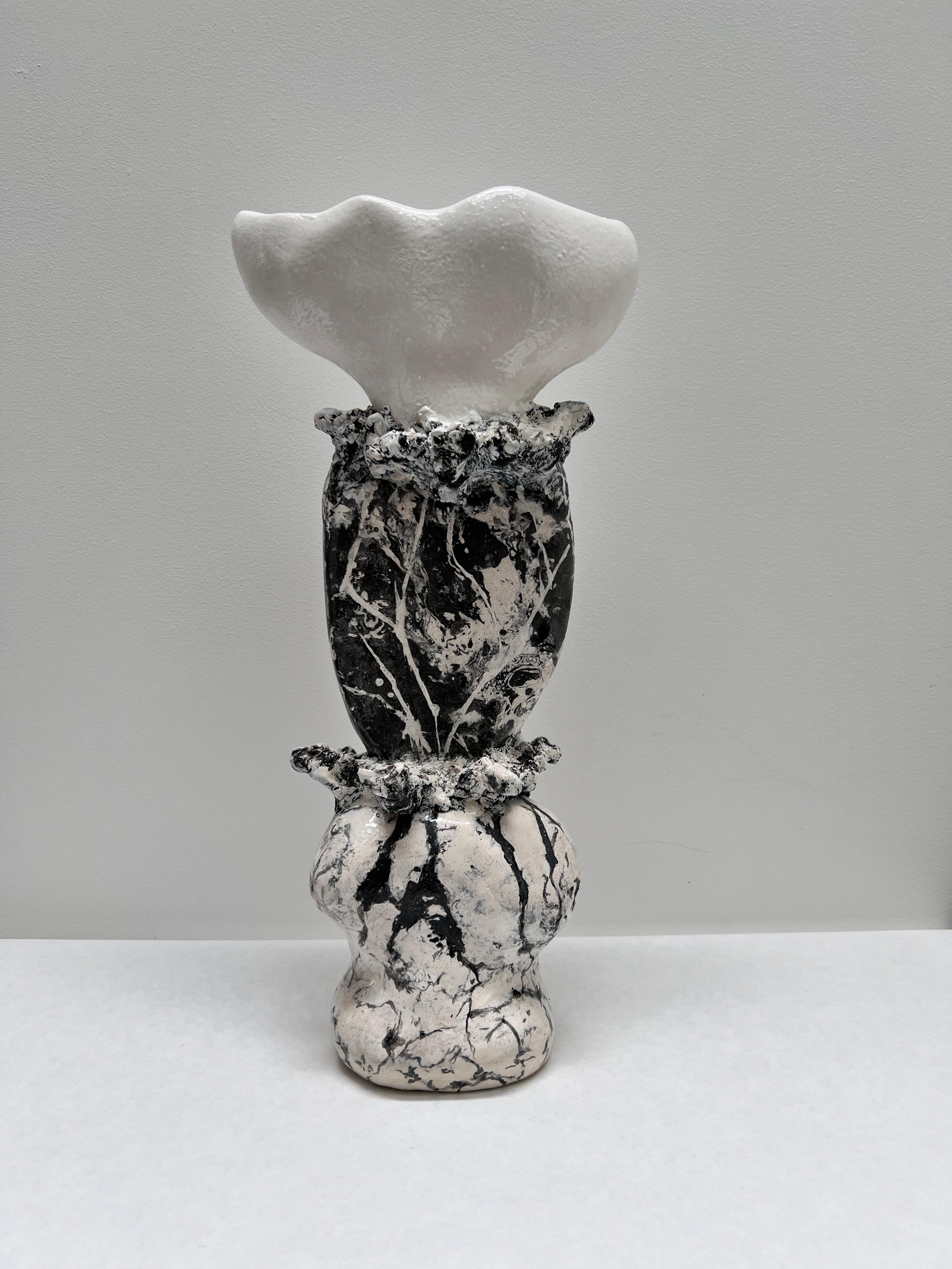 One of a kind  decorative object hand crafted in three interconnected sections and plays with contrasts - black and white, thick and thin and combines various materials.  The top part is an all white sculptural small vessel in a subtle texture and