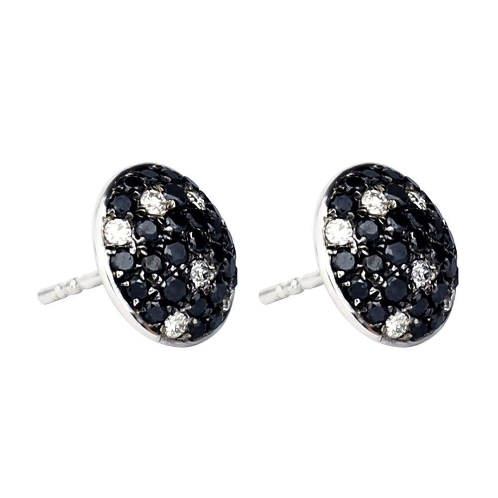 Cast from 18-karat gold, these beautiful stud earrings are set with 1.083 carats of black and white diamonds. 

FOLLOW MEGHNA JEWELS storefront to view the latest collection & exclusive pieces. Meghna Jewels is proudly rated as a Top Seller on