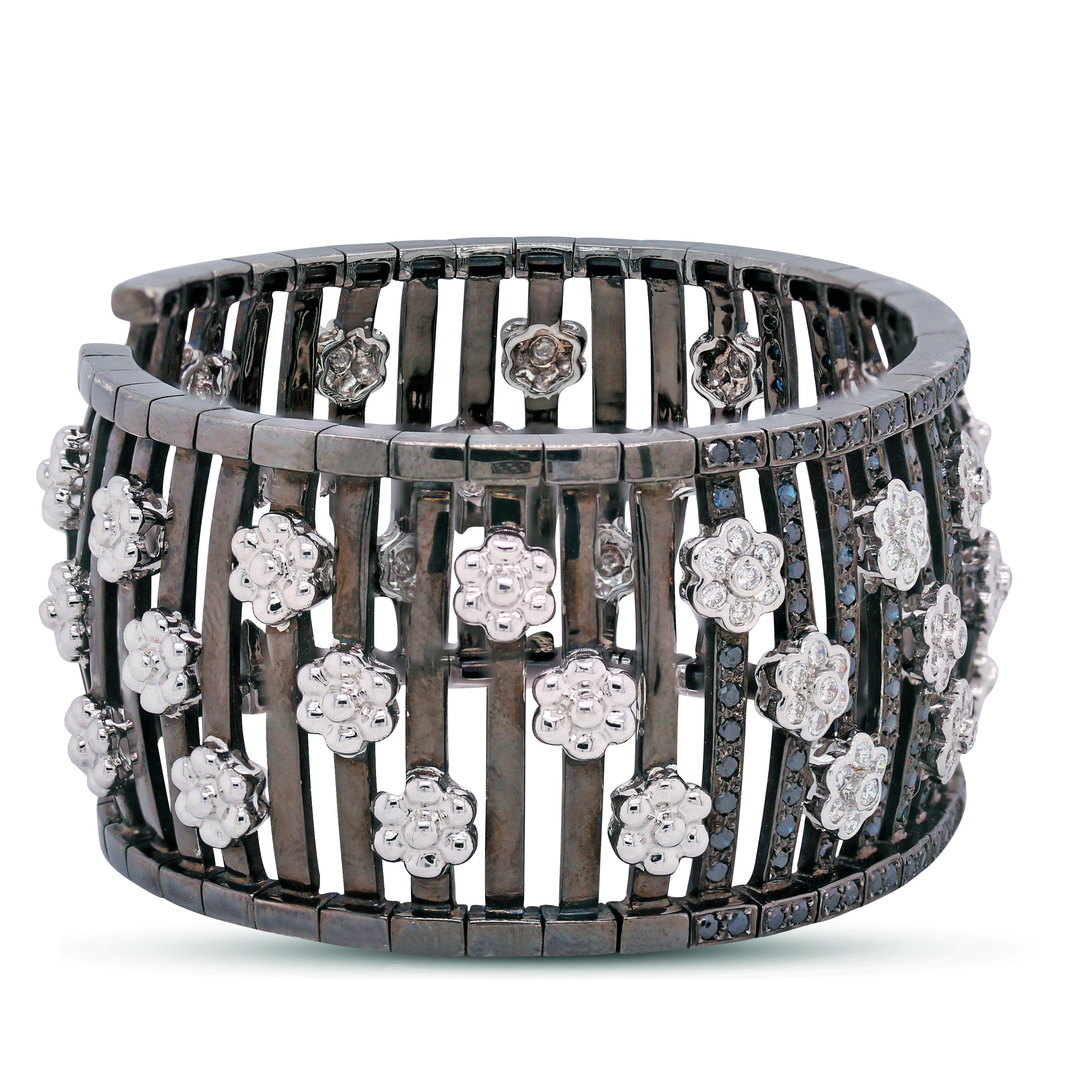 18K Black and White Gold Cuff Bracelet with Black and White Diamonds

This one-of-a-kind bracelet features diamond clusters set in white gold and black diamonds set in black gold

Diamond flower clusters are set throughout the piece.

1.50 carat G