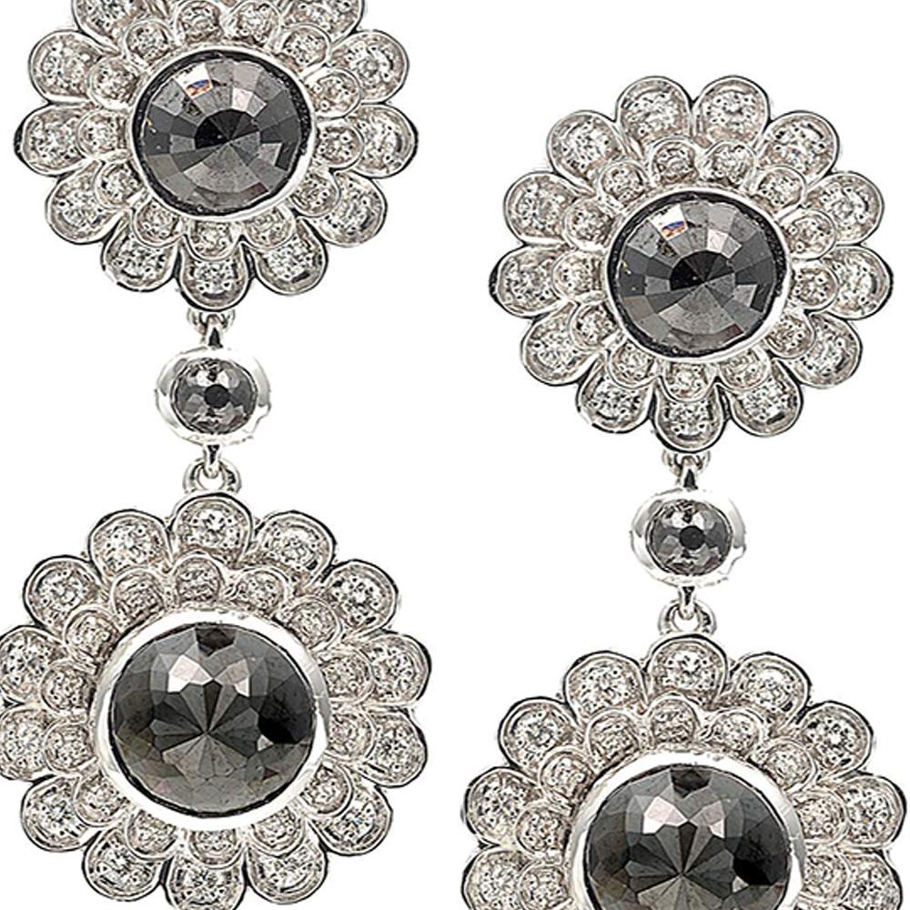 Trinity deco flower drop earrings set in 20 Karat White Gold with 6.98-carat Black Diamonds and 0.92-carat White Diamonds. These earrings are inspired by the Ganges River which is believed to unify our planet. 