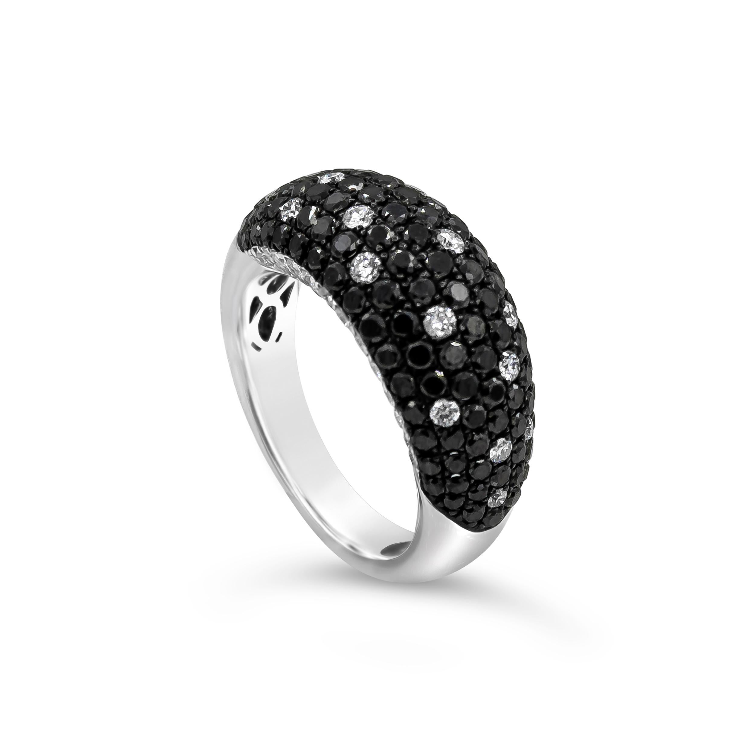 A exquisite and stylish ring showcasing black diamonds with white diamond accents, micro-pave set in a domed setting. Black diamonds weigh 1.68 carats total; white diamonds weigh 0.67 carats total. Finely made in 18K White Gold and Size 6.75 US