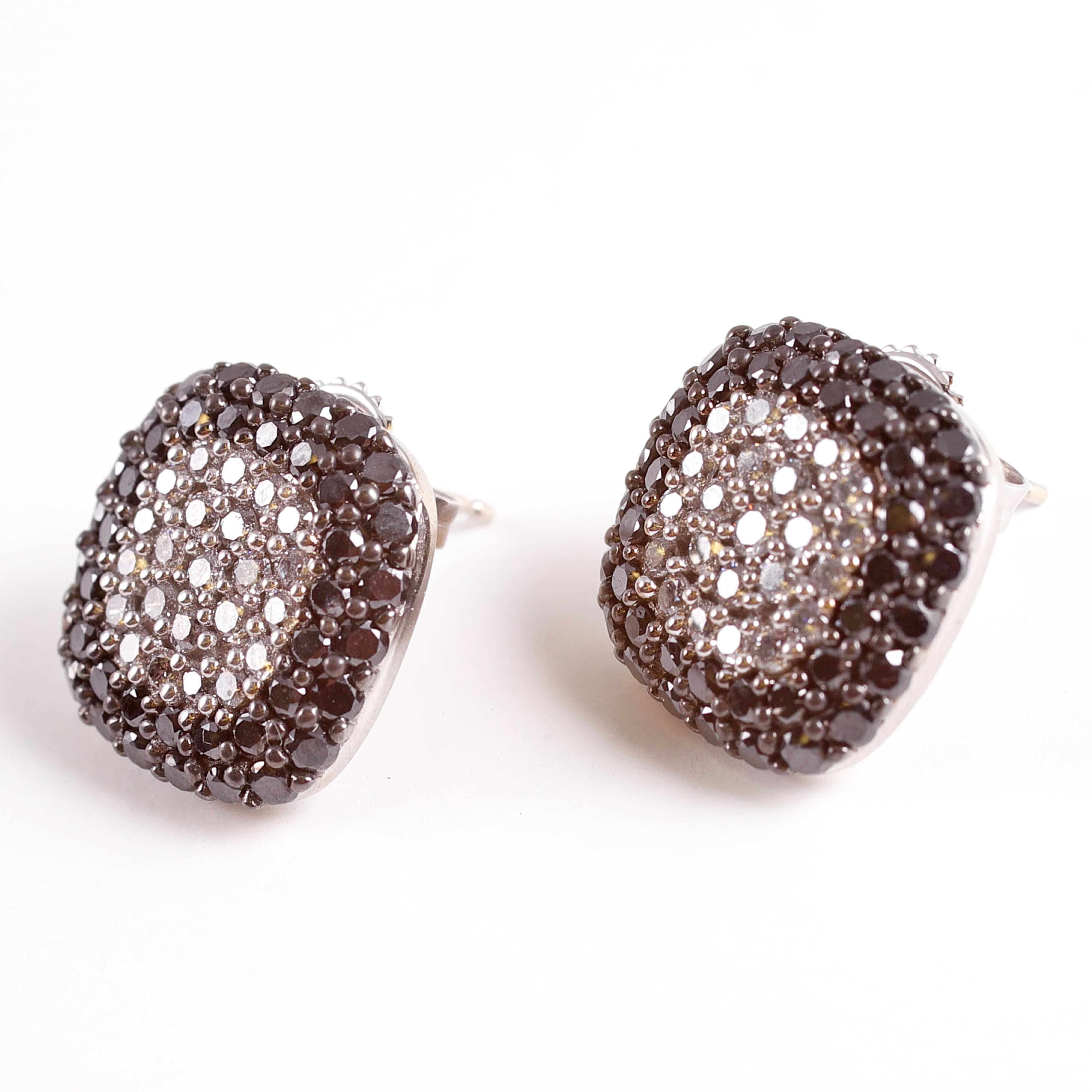 Pave set black and white diamonds set in 14 karat white gold by Effy.  Great earrings for any occasion!