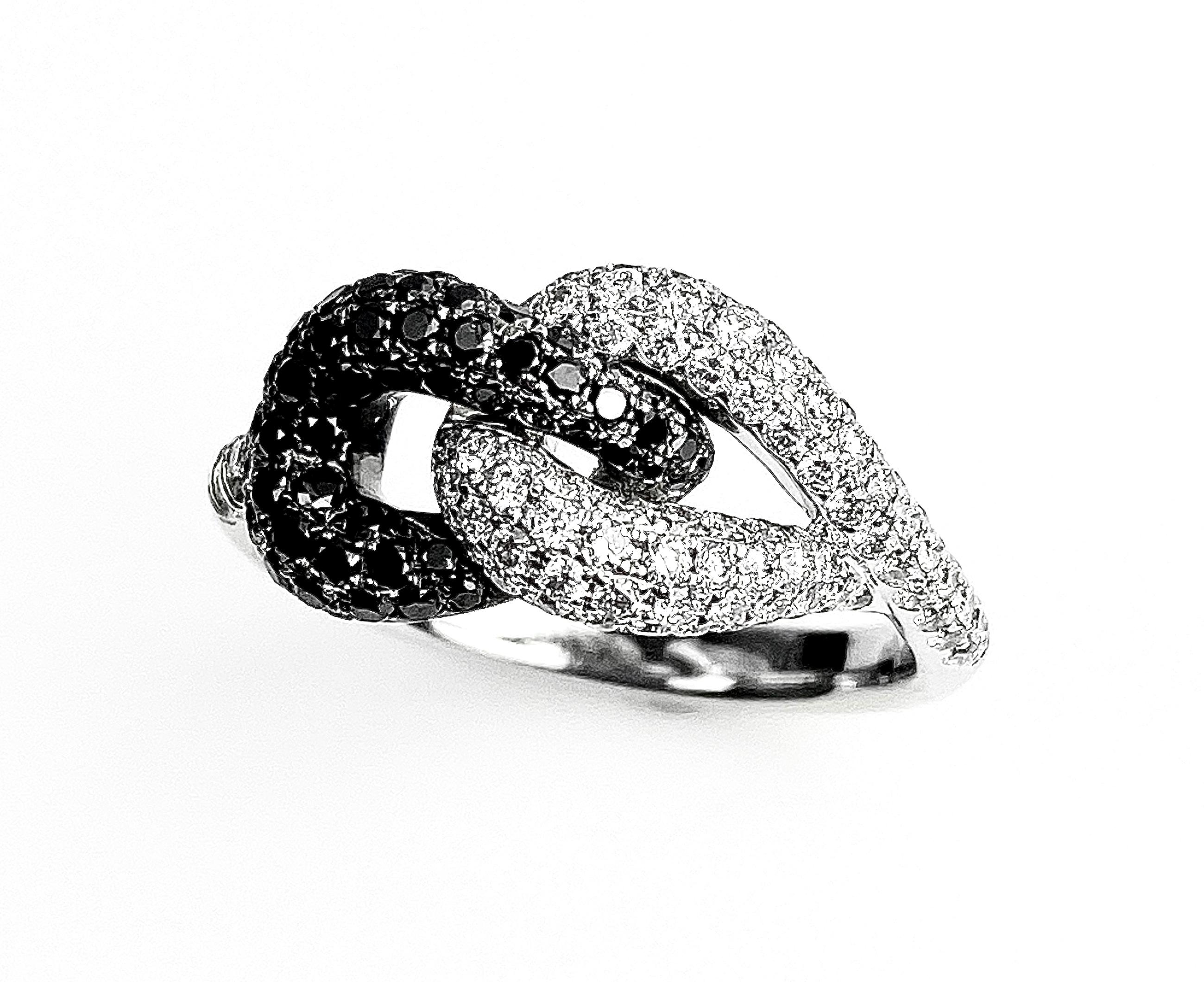 Ladies' knot ring in 18k white gold with 1.03tcw of pavé-set black and white diamonds, size 6 1/2. Resizing up or down 2 sizes included. 