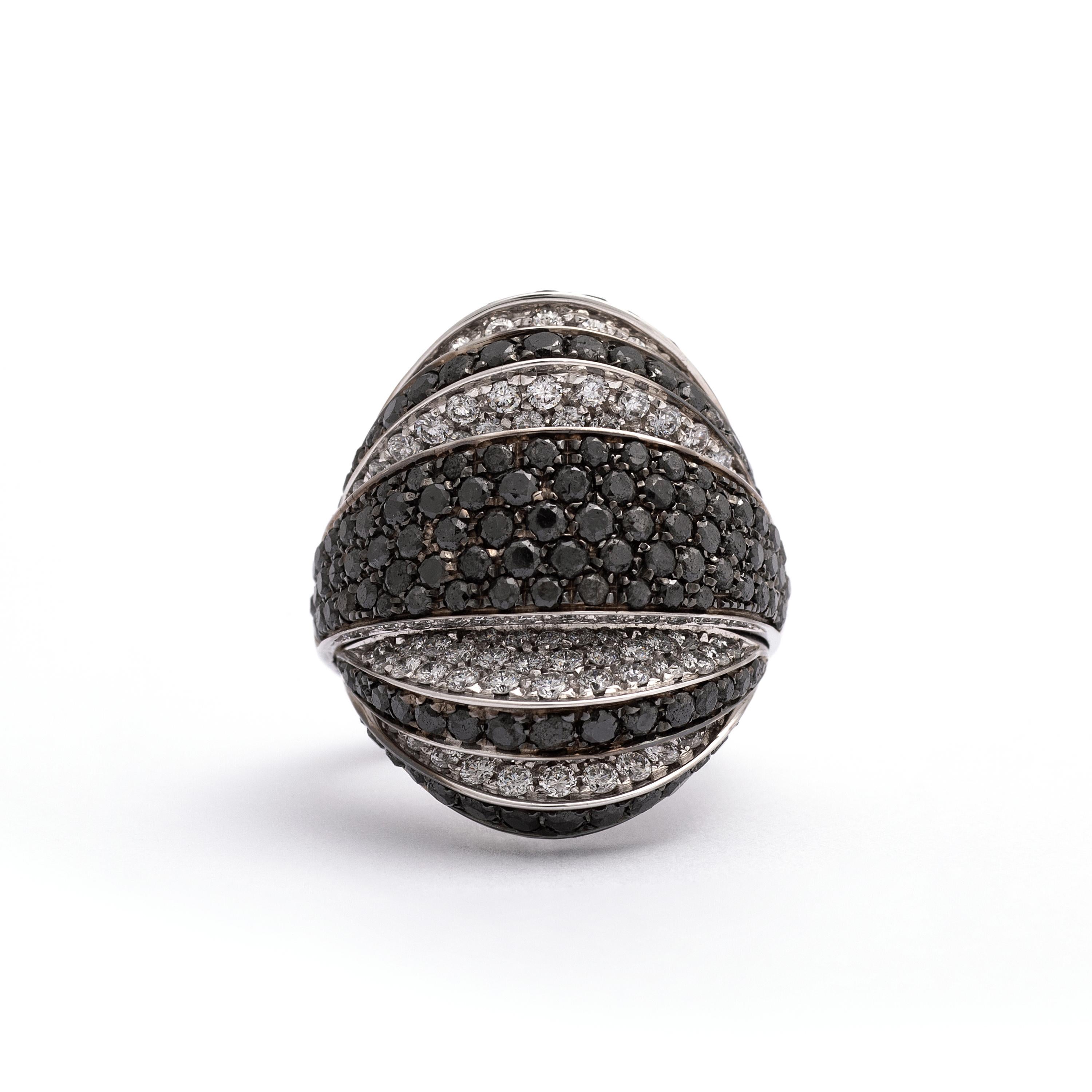 136 White Diamonds 1.92 carats and 138 Black Diamonds 3.90 carats on white gold Ring.
Contemporary.