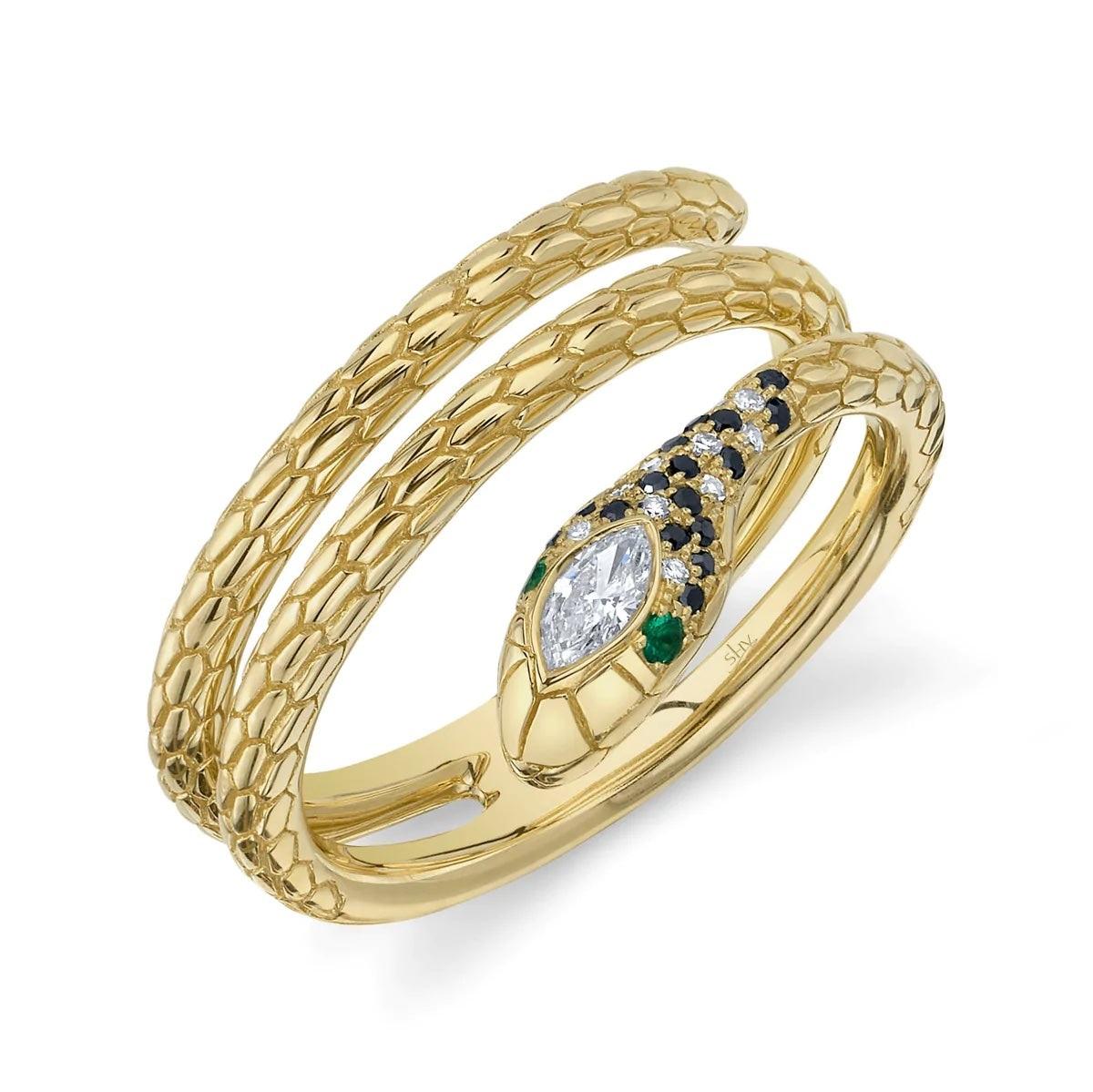 14kt yellow gold snake ring with black and white diamond (0.17ct total weight) scales and emerald eyes (00.2ct total weight). Size 7.

