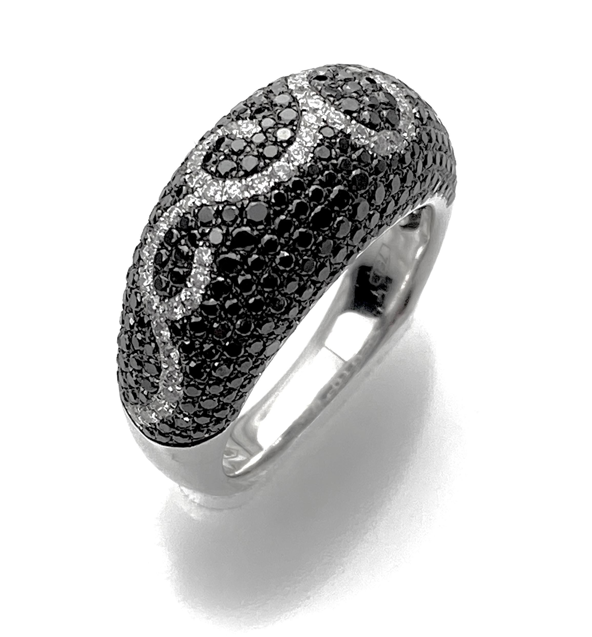 Black and white diamond swirl ring in 18kt white gold with 1.83ct total of pavé-set diamonds. Ring size 6 1/2. Resizing up or down 2 sizes included in the price.