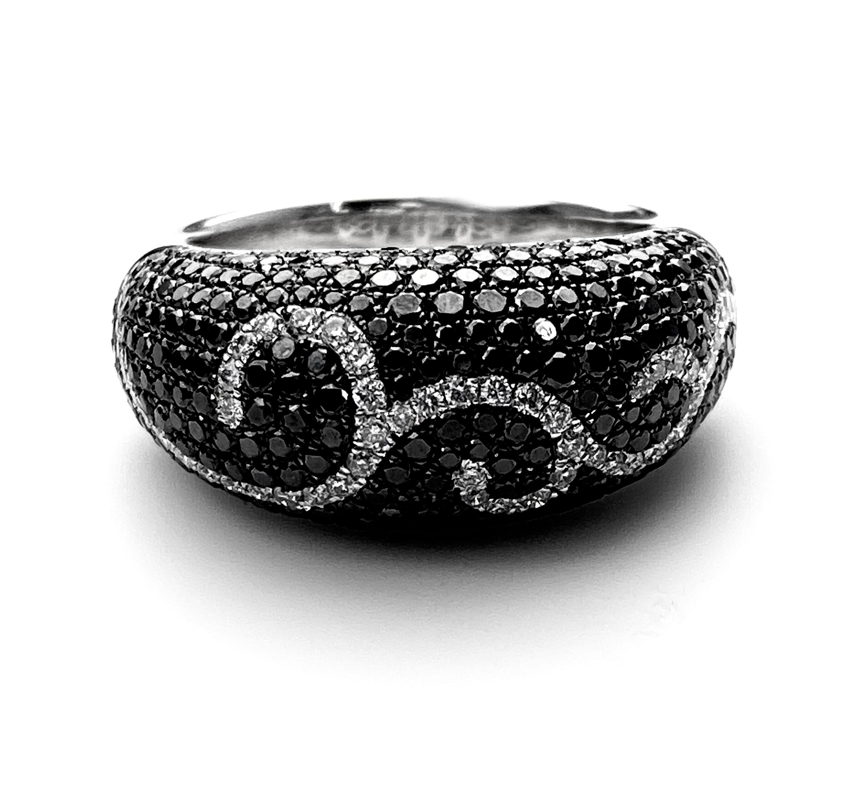 Contemporary Black and White Diamond Swirl Ring in White Gold For Sale