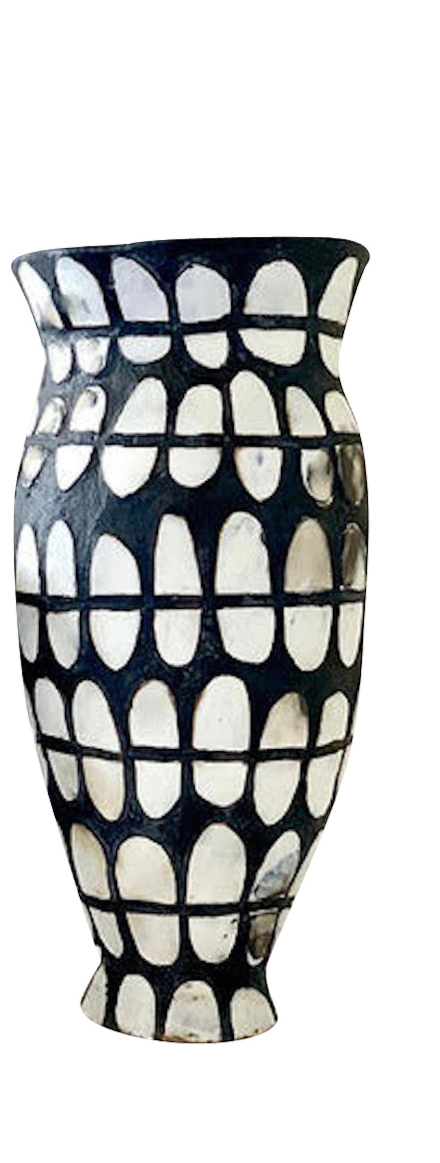 Contemporary American ceramicist Brenda Holzke hand made unique one of a kind stoneware vase made of porcelain design and black oxide stain.
Low with open mouth shape.
