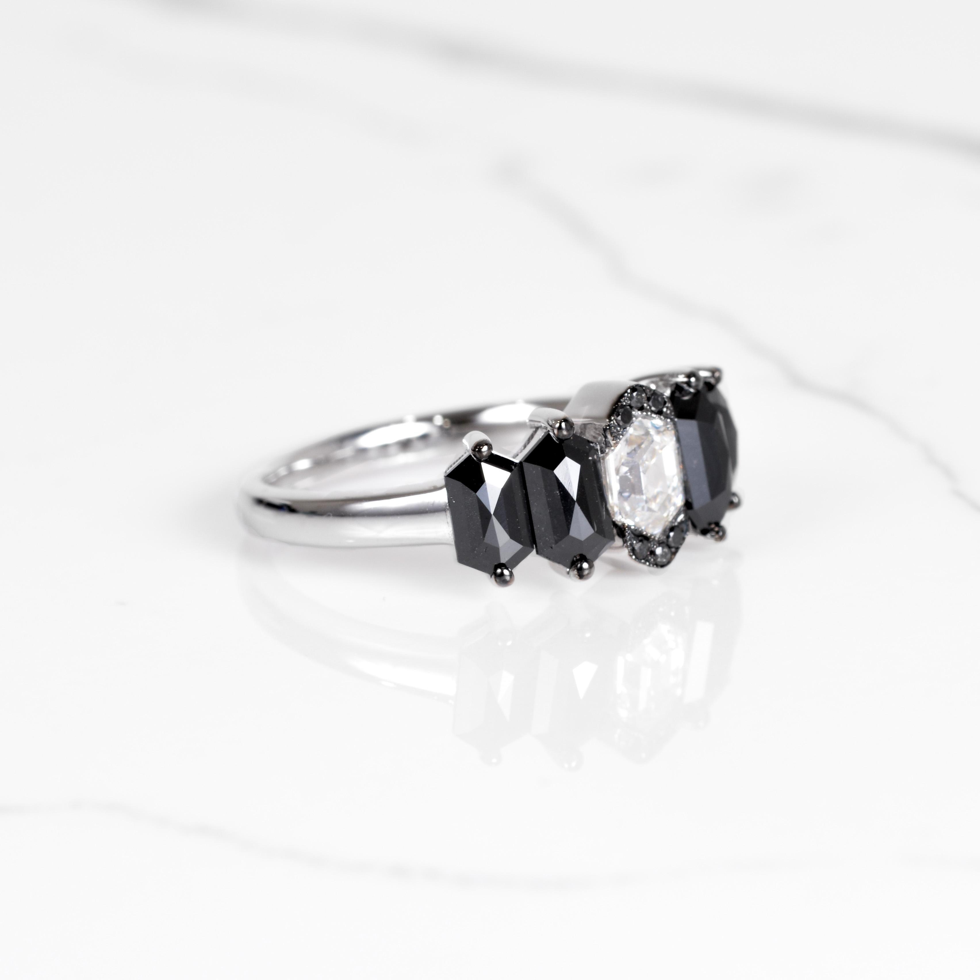 Black and white diamonds sure do go great together! The diamonds in this ring are hexagon cut diamonds which make for a unique and stunning look. The elongated hexagon cut black diamonds total 2 carats and surround a beautiful hexagon cut white