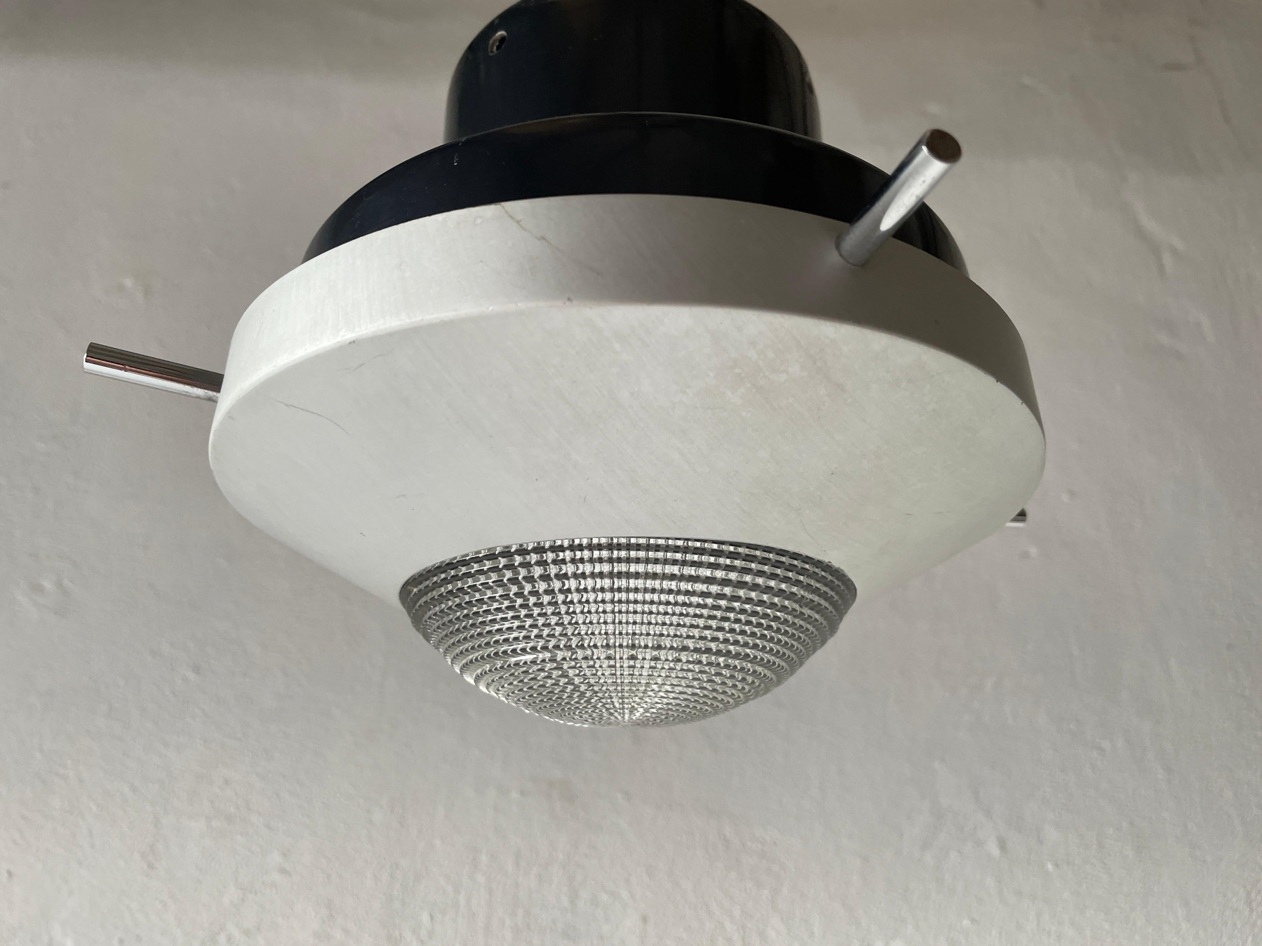 Black and white industrial flush mount light, in style of Stilnovo, 1960s, Italy

This lamp works with E27 light bulbs. 
Wired and suitable to use with 220V and 110V for all countries.

Measurements:
Diameter : 24 cm
Height: 15 cm.