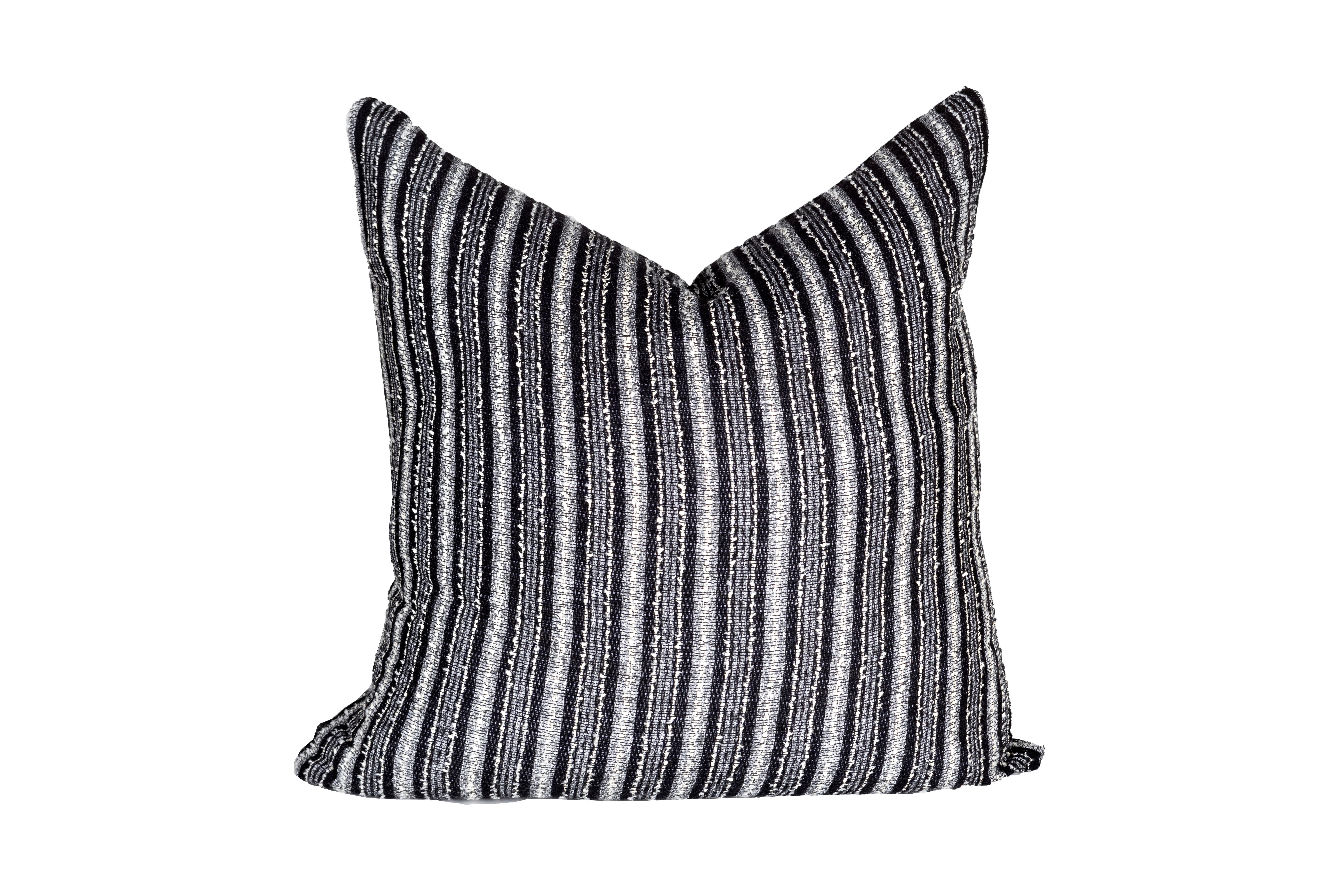 This beautiful pillow is composed of vintage Italia boucle. The black and white contrast is striking, while the quality craftsmanship provides a softness that will be hard to resist. This down filled pillow is stuffed with high-quality down feathers