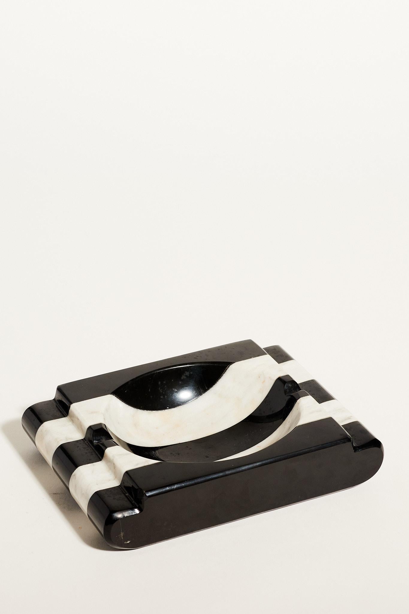 Black and white striped marble catchall or ashtray.