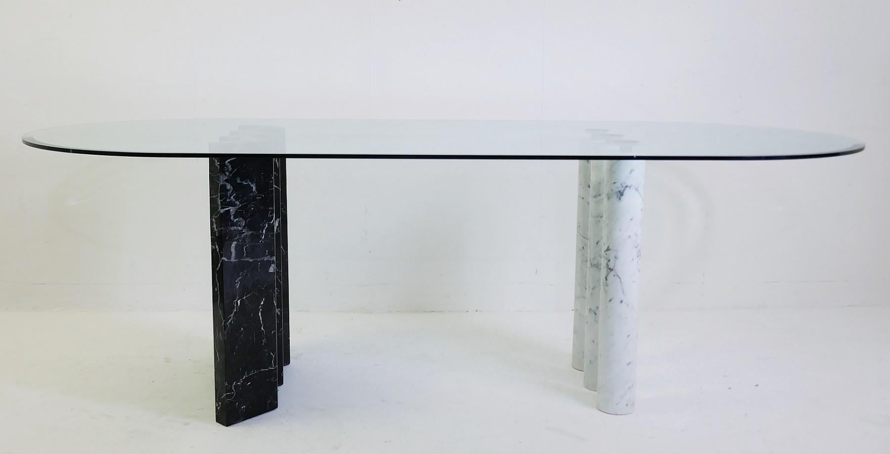 Black and white marble and glass top dining tables.