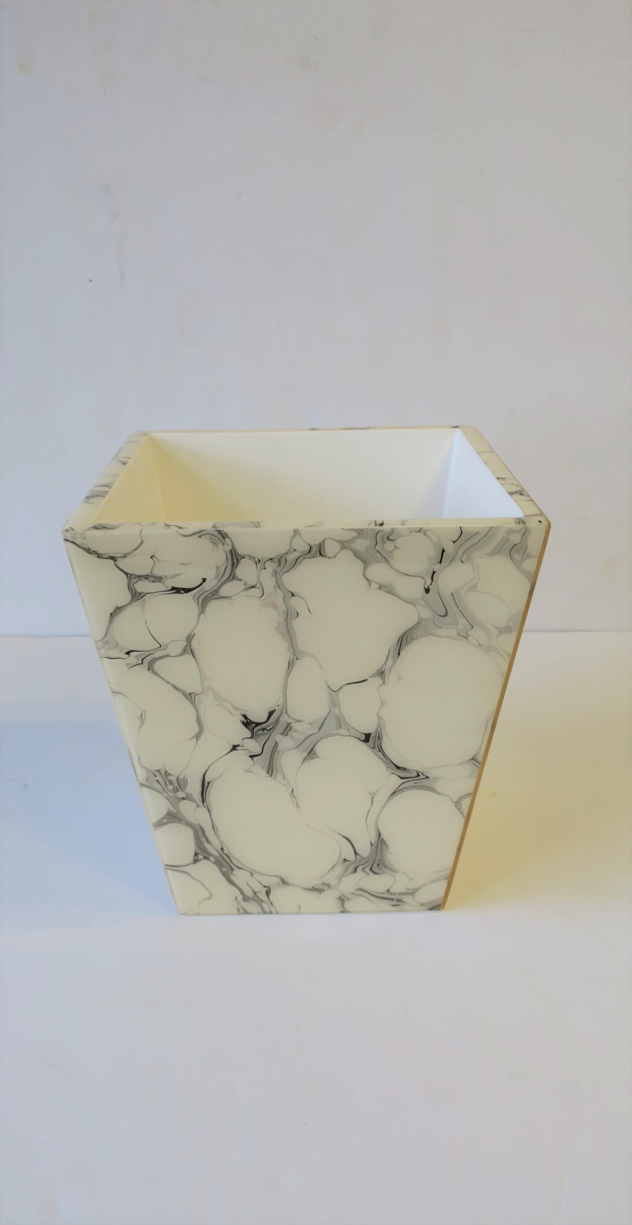 A beautiful black and white marbleized wastebasket [waste basket] or trash can set. Wastebasket set has an acrylic marble-like veneer with a white lacquer interior. Set includes 1 wastebasket, 2 boxes with lids, and 2 vanity or desk vessels. A five