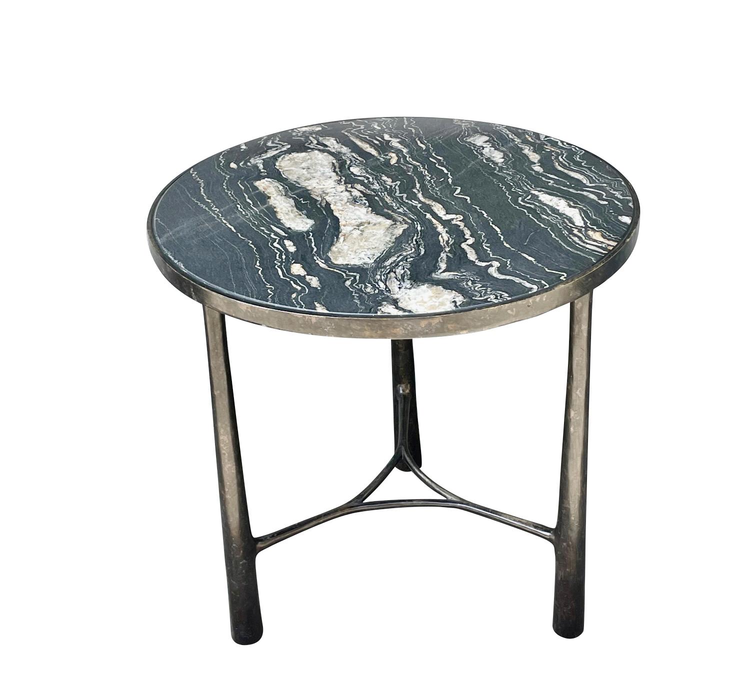 Contemporary German bronze coffee table with black and white marble top.
Three tubular legs.