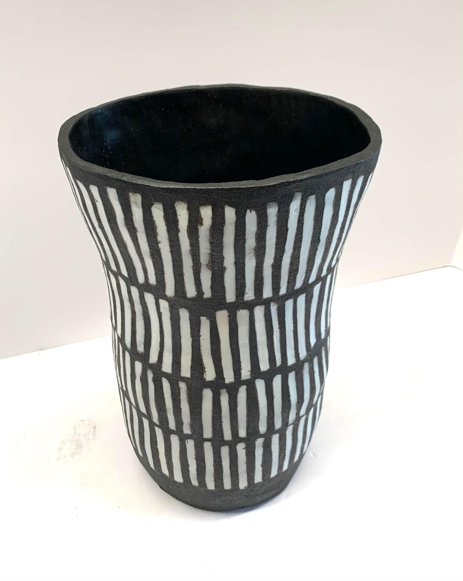 Contemporary American ceramicist Brenda Holzke hand made unique one of a kind stoneware vase that made of dark stoneware and porcelain slip.
Matchstick design.