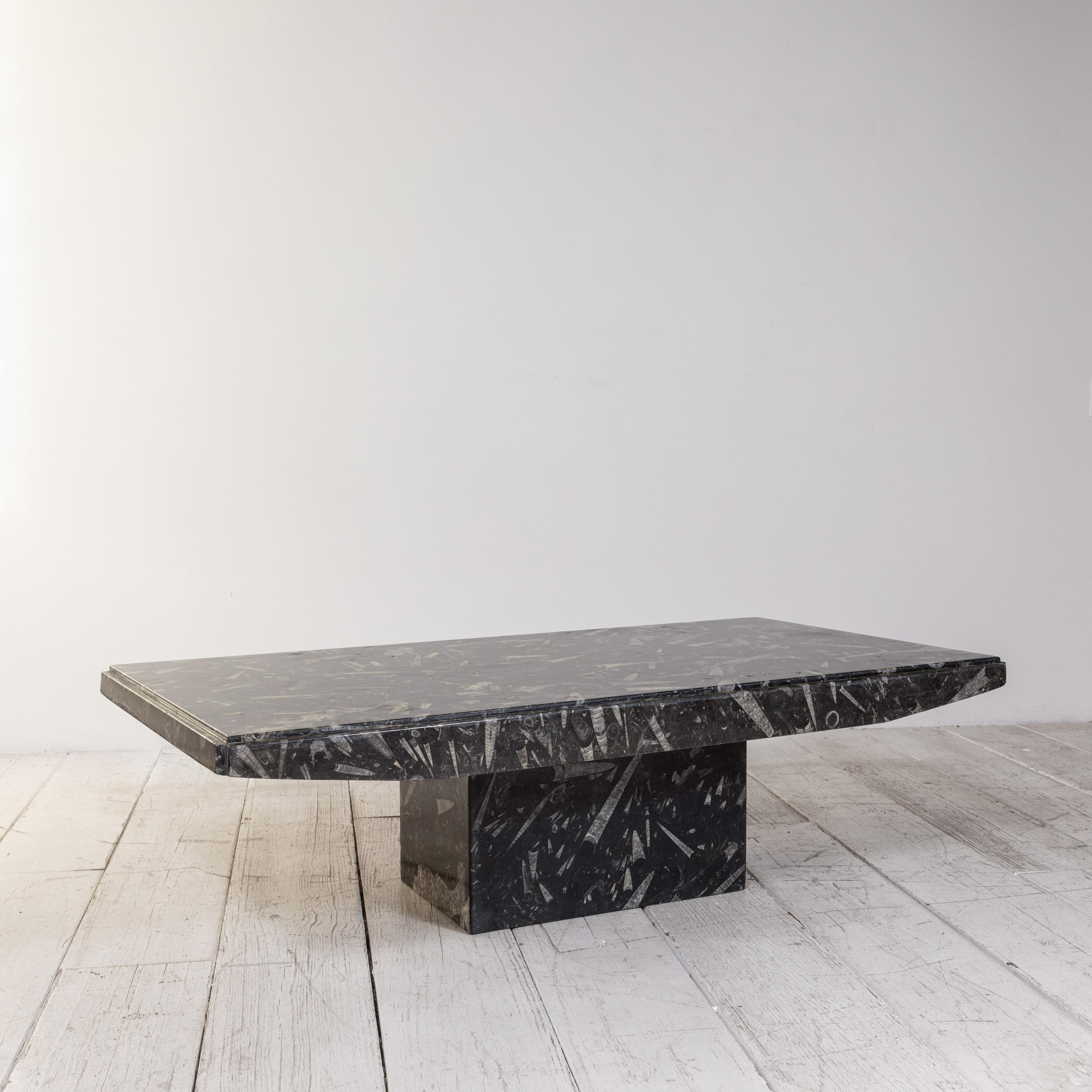 Black and white modernist marble cocktail table adds a modern clean touch to any space.