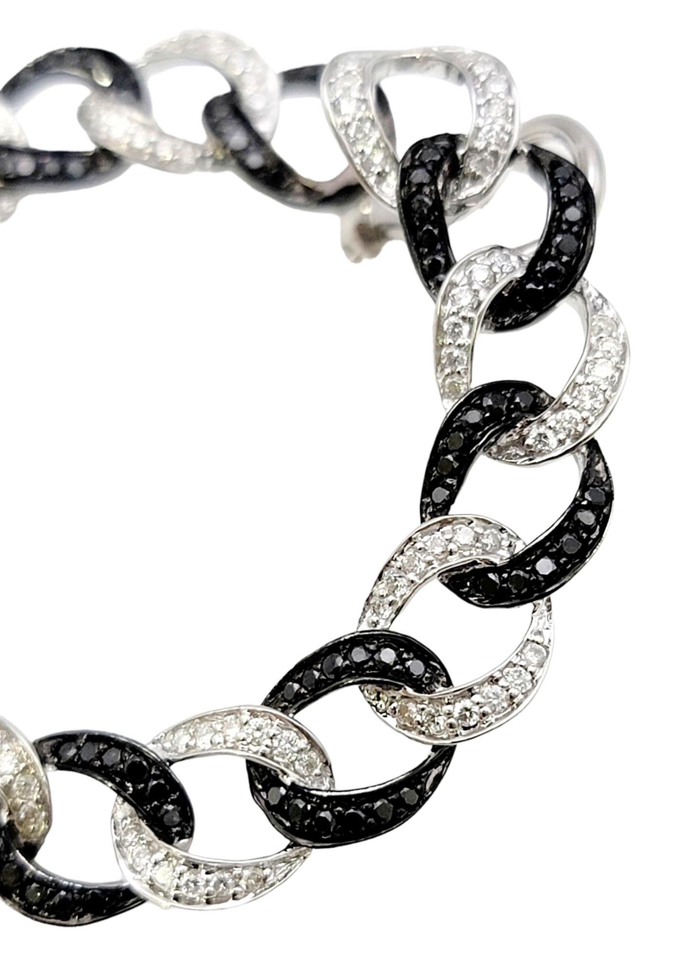 If you are looking for dazzling sparkle from every angle, these stunning pave diamond hoop earrings will not disappoint! With the unique black and white diamond detailing, the classic hoop design gets a modernized look with a sophisticated feel.