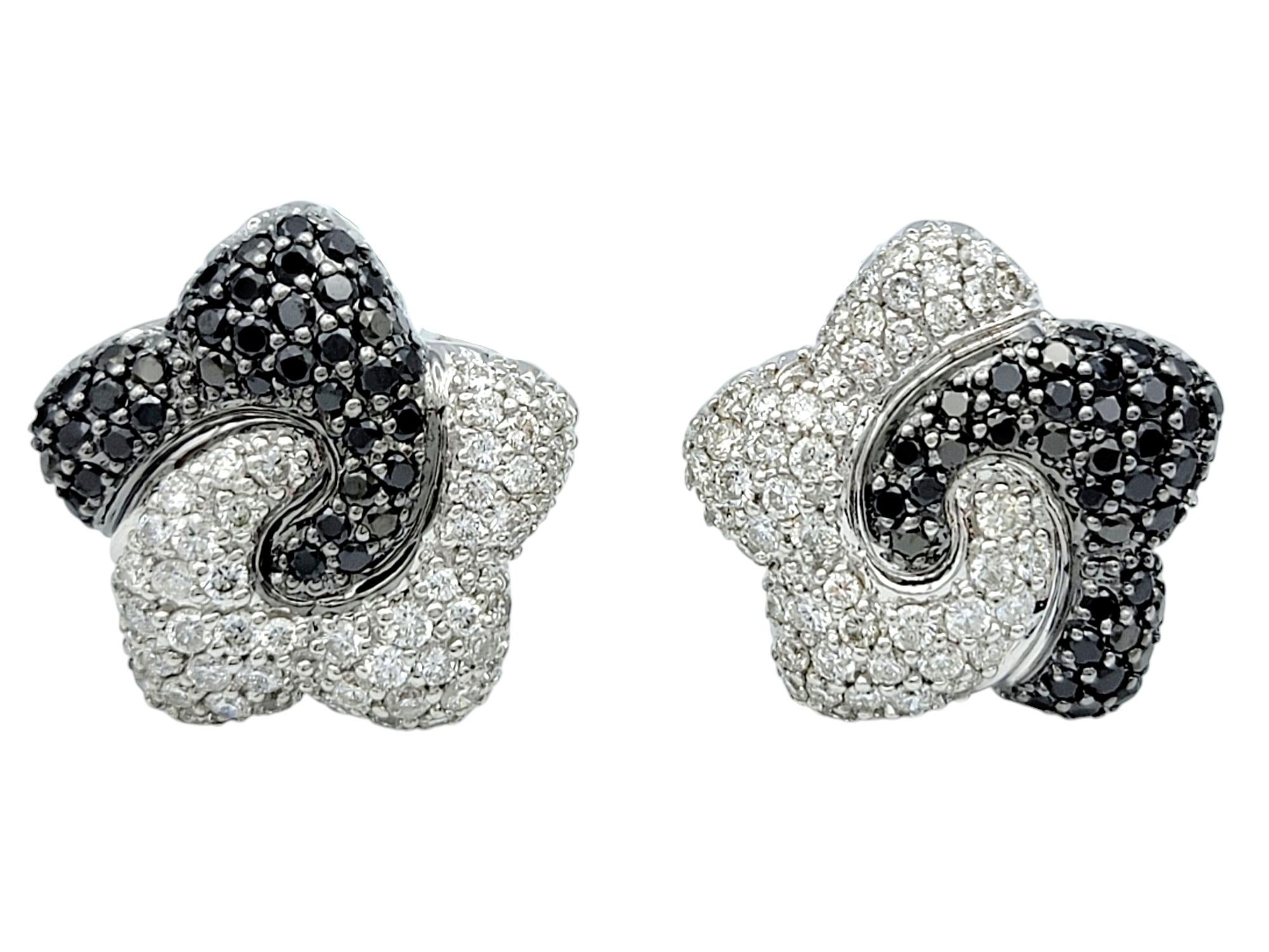 Capture celestial elegance with these dazzling omega-back star stud earrings, a perfect blend of cosmic allure and contemporary sophistication. Expertly crafted in radiant 18 karat white gold, each star bursts with brilliance through a mesmerizing