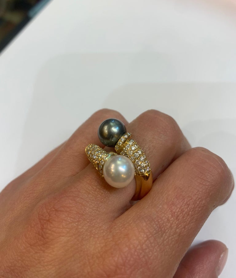 There's an understated elegance to this 'Toi et Moi' ring. Two Japanese pearls have been set in 18kt Yellow Gold by our fifth generation goldsmith. cts of White VVS-F Diamonds have been pavé set in the 18kt Yellow Gold tube like shoulders which