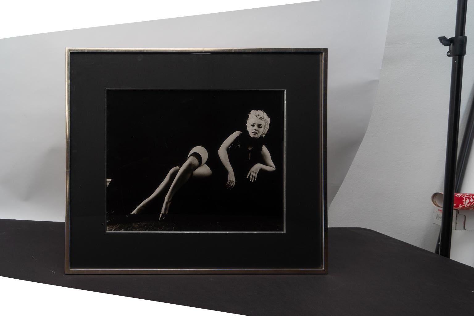 This photograph was acquired from a Palm Beach estate and is a 1978 print from the original negative of the photo taken in the 1950s by Milton H. Greene when Marilyn Monroe (Norma Jeane Mortenson) was an aspiring model and actress.

The piece is