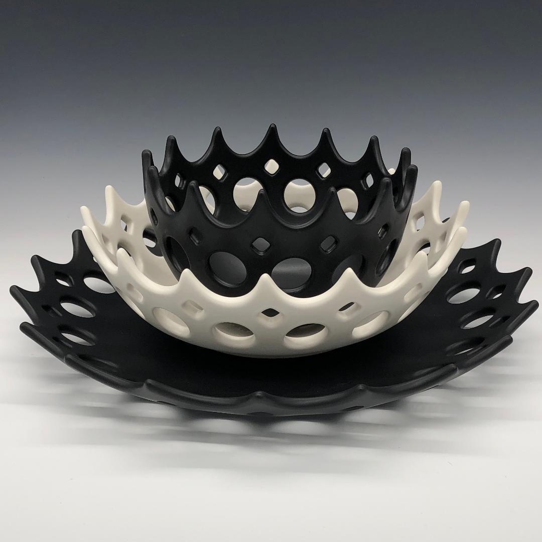 Inspired by Mid-Century Modern design, these bowls thrown wheel thrown and hand pierced stoneware. Small holes are created when the clay is still wet and then each hole is painstakingly enlarged and smoothed when the clay is bone dry. It is then