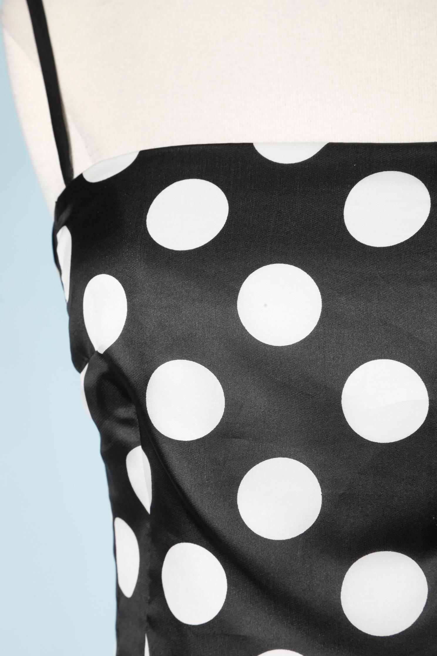 Black and white Polka-dots silk cocktail dress with sunray pleated skirt. Lining composition: acetate. 
Zip and hook&eye closure on the middle back. Adjustable shoulder straps. 
SIZE 40 (It) 36 (Fr) 4 (Us) XS/ S 