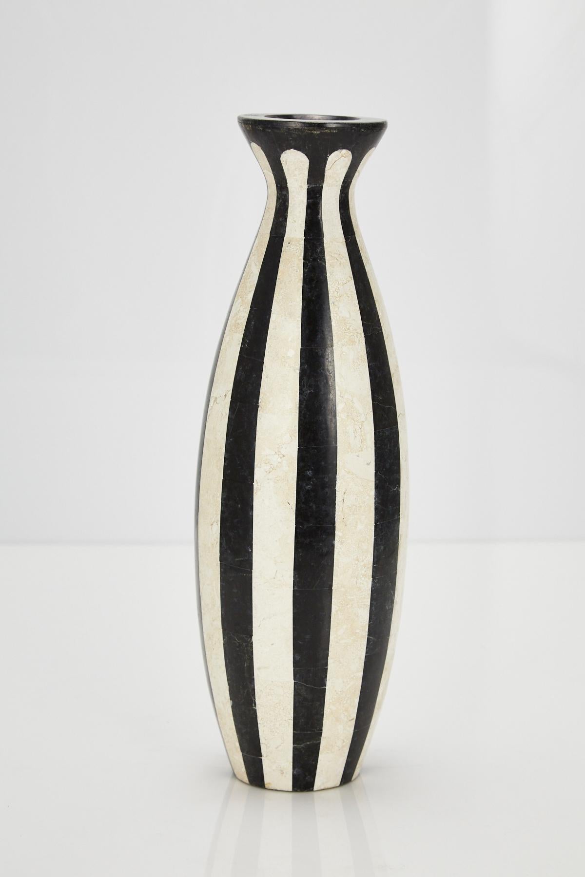 Tall bottle shaped black and white tessellated stone 