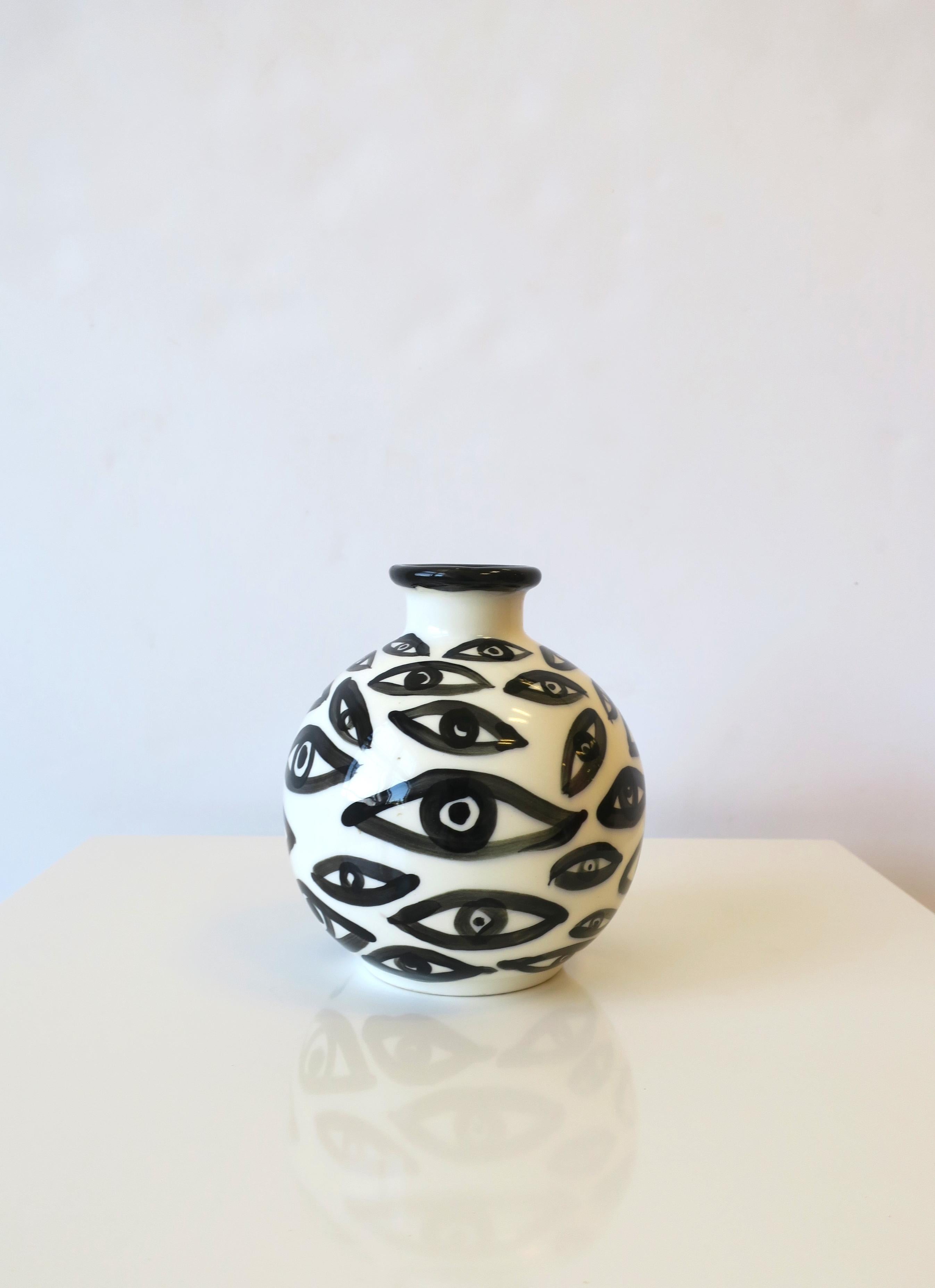 A beautiful black and white ceramic pottery vase with 'eye' design. A great addition to any room. Dimensions: 5.75