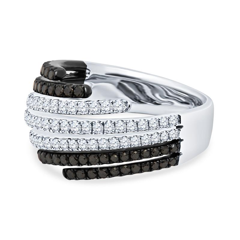 This fashion ring features multiple rows with 0.59 carat total weight in round brilliant white diamonds and 0.51 carat total weight in round black diamonds set in seven rows in 18 karat white gold. Make a statement by wearing this ring. It is a size