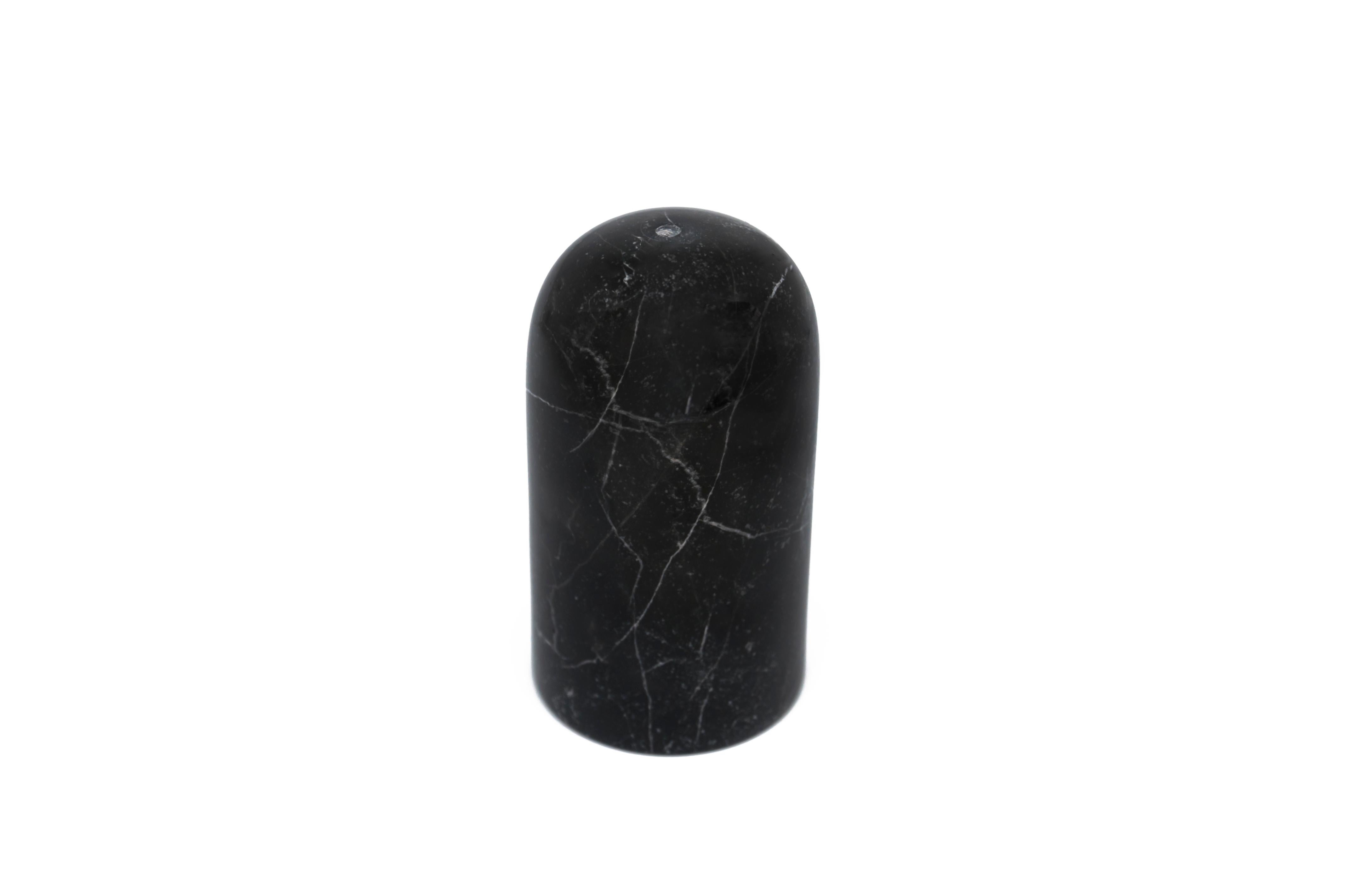 Black and white rounded shape salt and pepper set.
Each piece is in a way unique (since each marble block is different in veins and shades) and handcrafted in Italy. Slight variations in shape, color and size are to be considered a guarantee of a