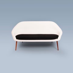 Curvy Danish modern black and white sofa with large seat cushion