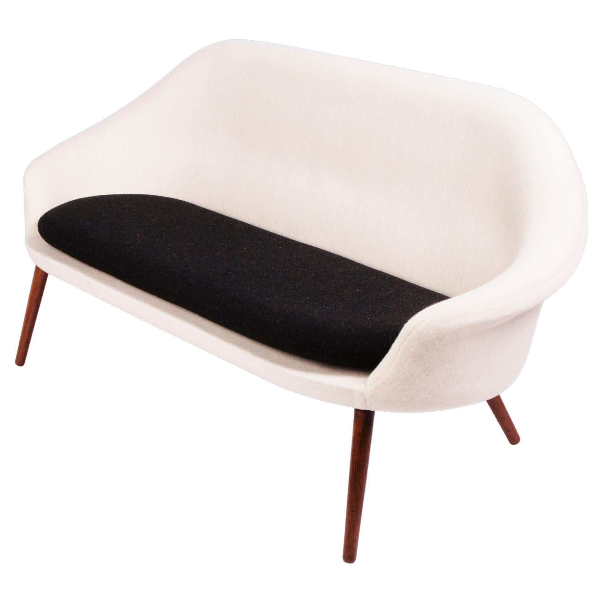 Curvy Danish modern black and white sofa with large seat cushion For Sale