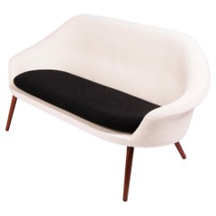 Curvy Danish modern black and white sofa with large seat cushion