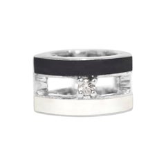 Boucles d'oreilles manchette rayées noires et blanches avec saphirs blancs
