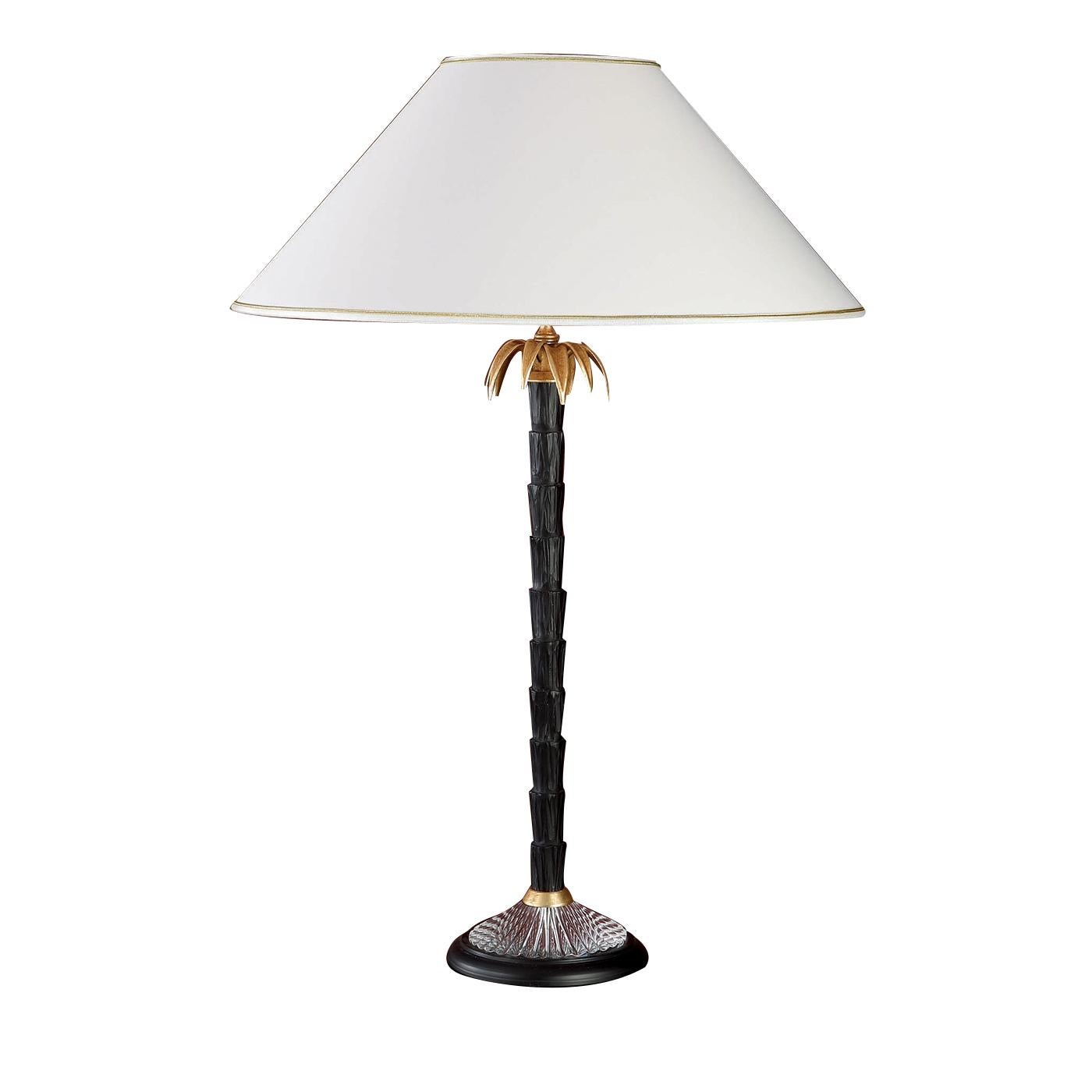 This exquisite table lamp will be a magnificent addition to a Classic or a contemporary decor. Its timeless design, combined with masterful craftsmanship, will add a luxurious accent to a study, living room, or entryway. The crystal base supports a