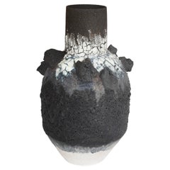 Black and white textured volcanic vase with black clay 'rocks' and iron filings
