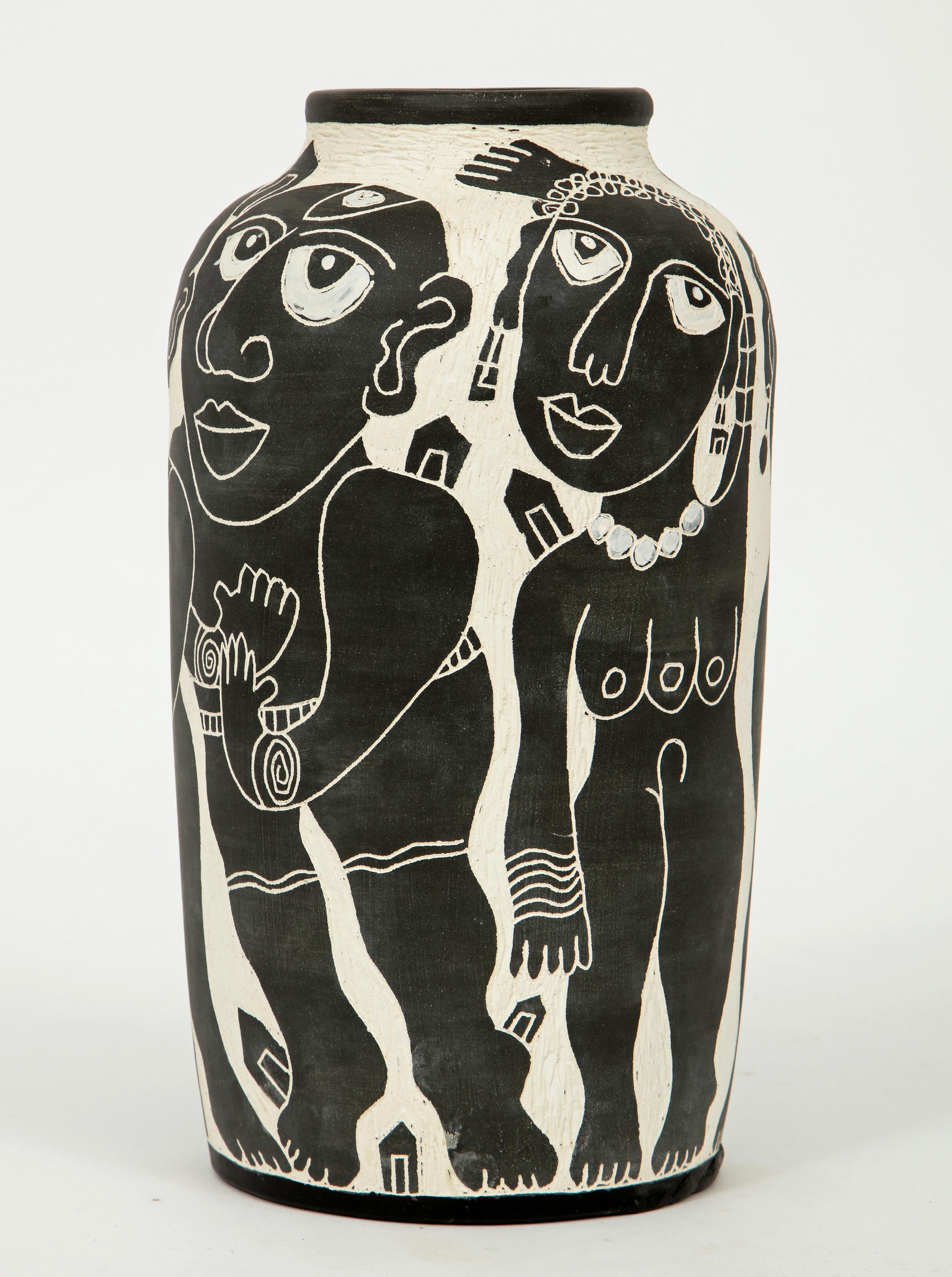 Fabulous example of Washington Ledesma's hand-carved sculptural ceramic work at it's best with various nude and semi nude women and men circling this vase. He is considered to be one of Latin America's most significant artists living in the United