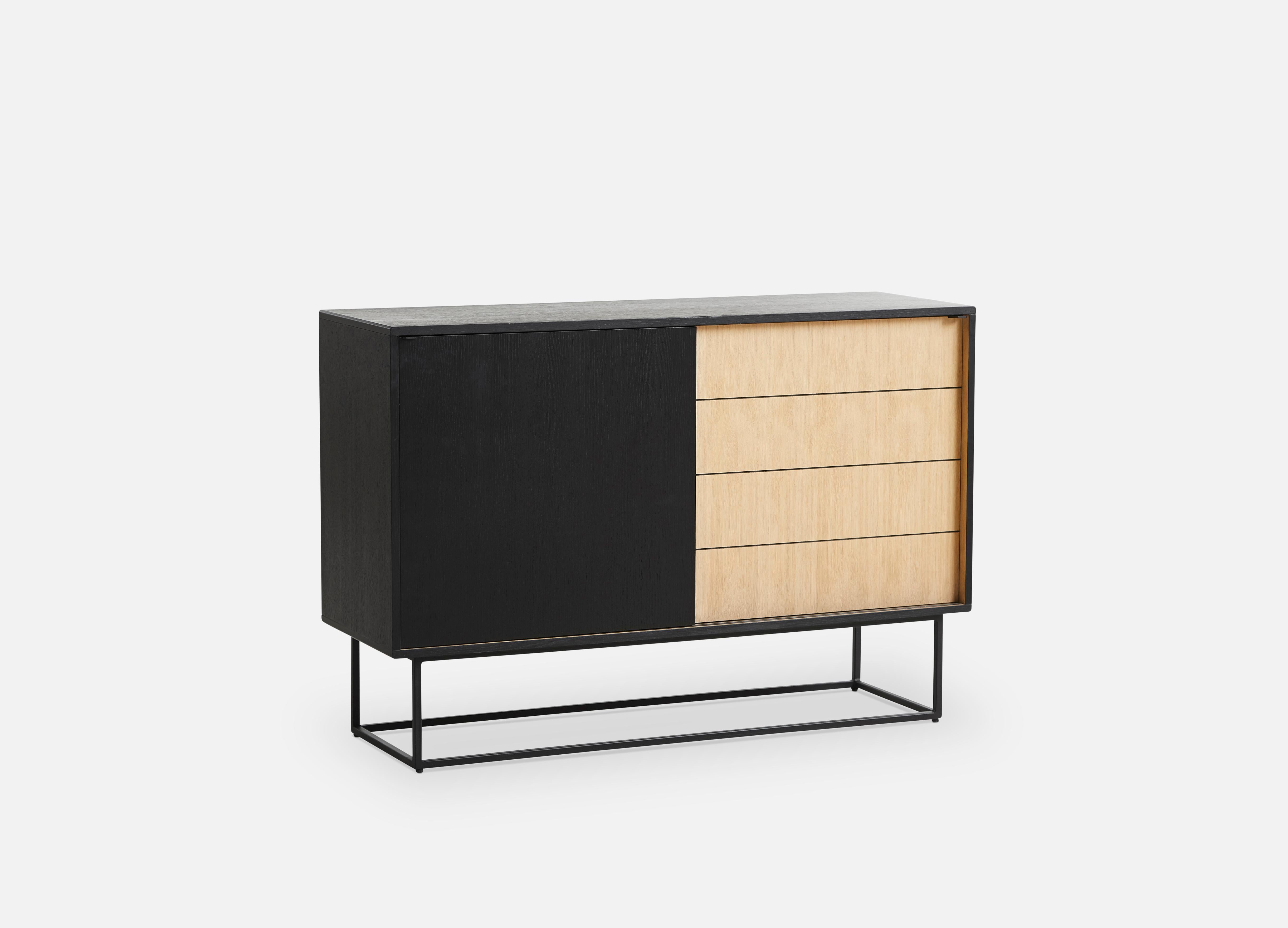 Black and white oak Virka high sideboard by Ropke Design and Moaak
Materials: oak, metal.
Dimensions: D 40 x W 120 x H 82 cm
Also available in different colours and materials.

The founders, Mia and Torben Koed, decided to put their 30 years of