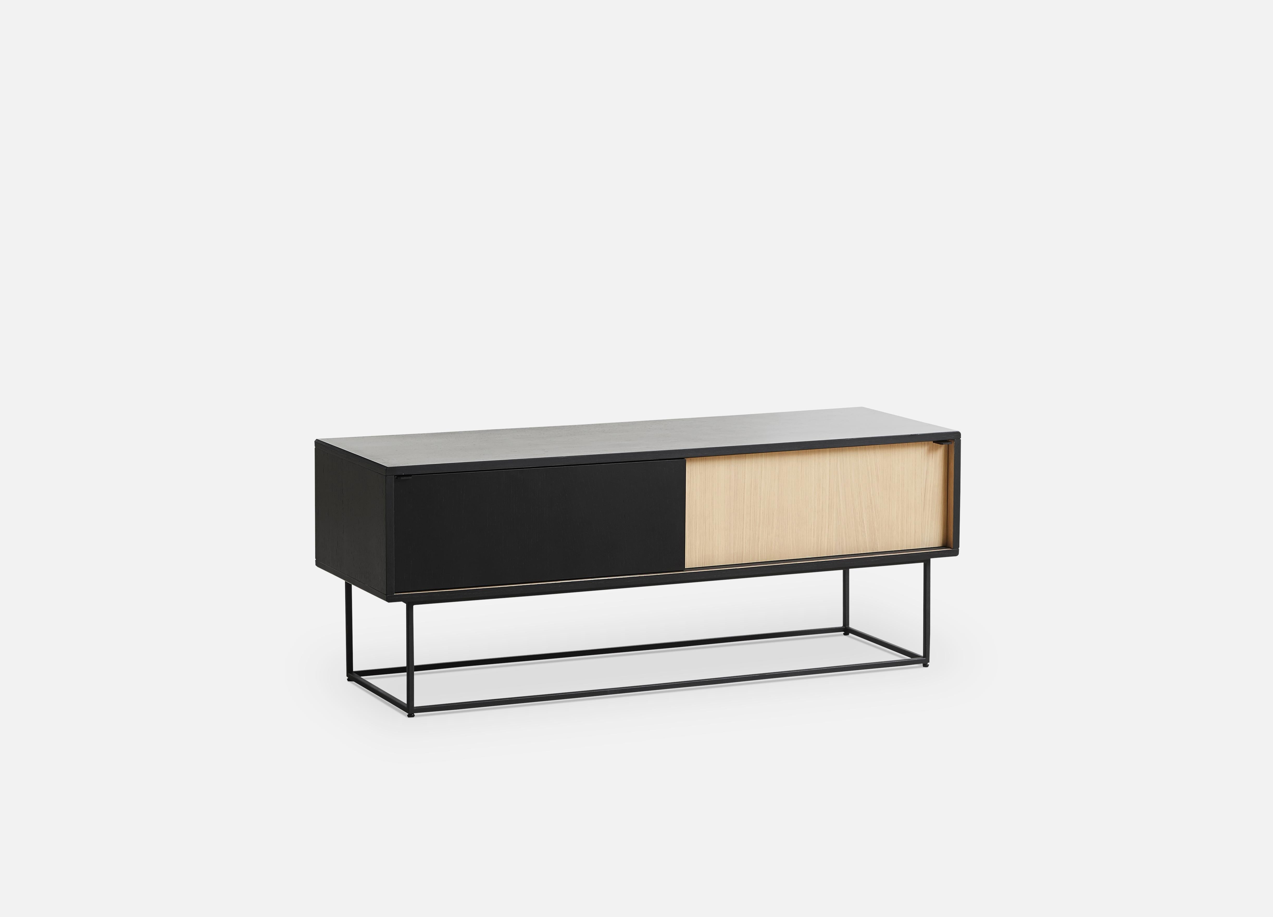 Black and white virka low sideboard by Ropke Design and Moaak
Materials: Oak, metal.
Dimensions: D 40 x W 120 x H 47 cm
Also available in different colours and materials.

The founders, Mia and Torben Koed, decided to put their 30 years of