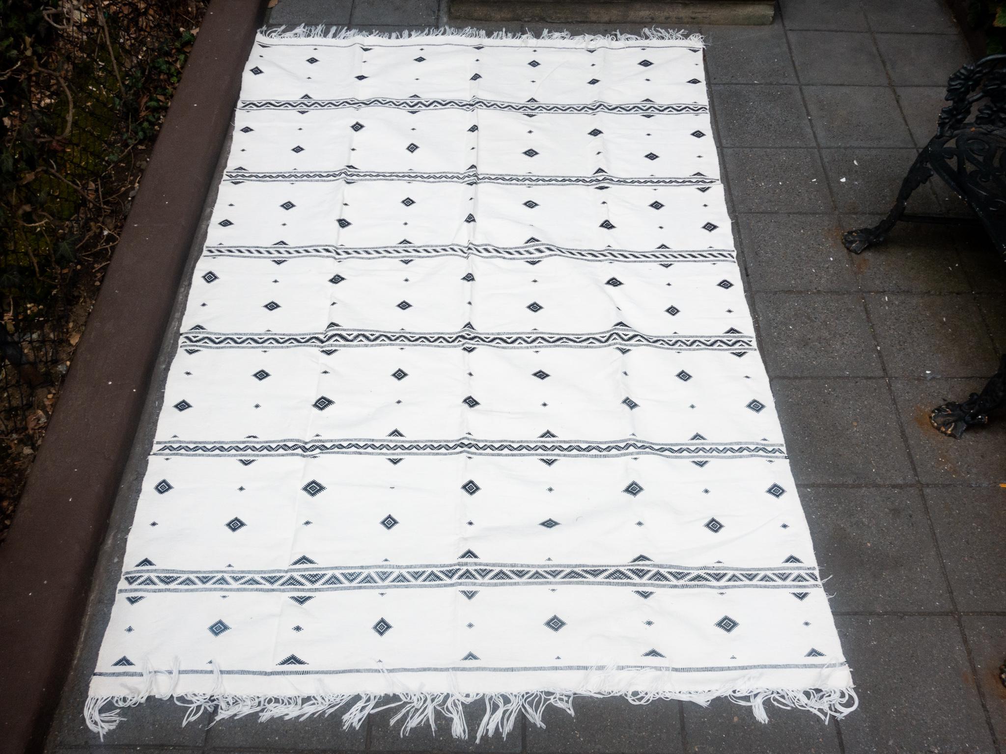 Black and white cotton woven rug from Tangier, Morocco.