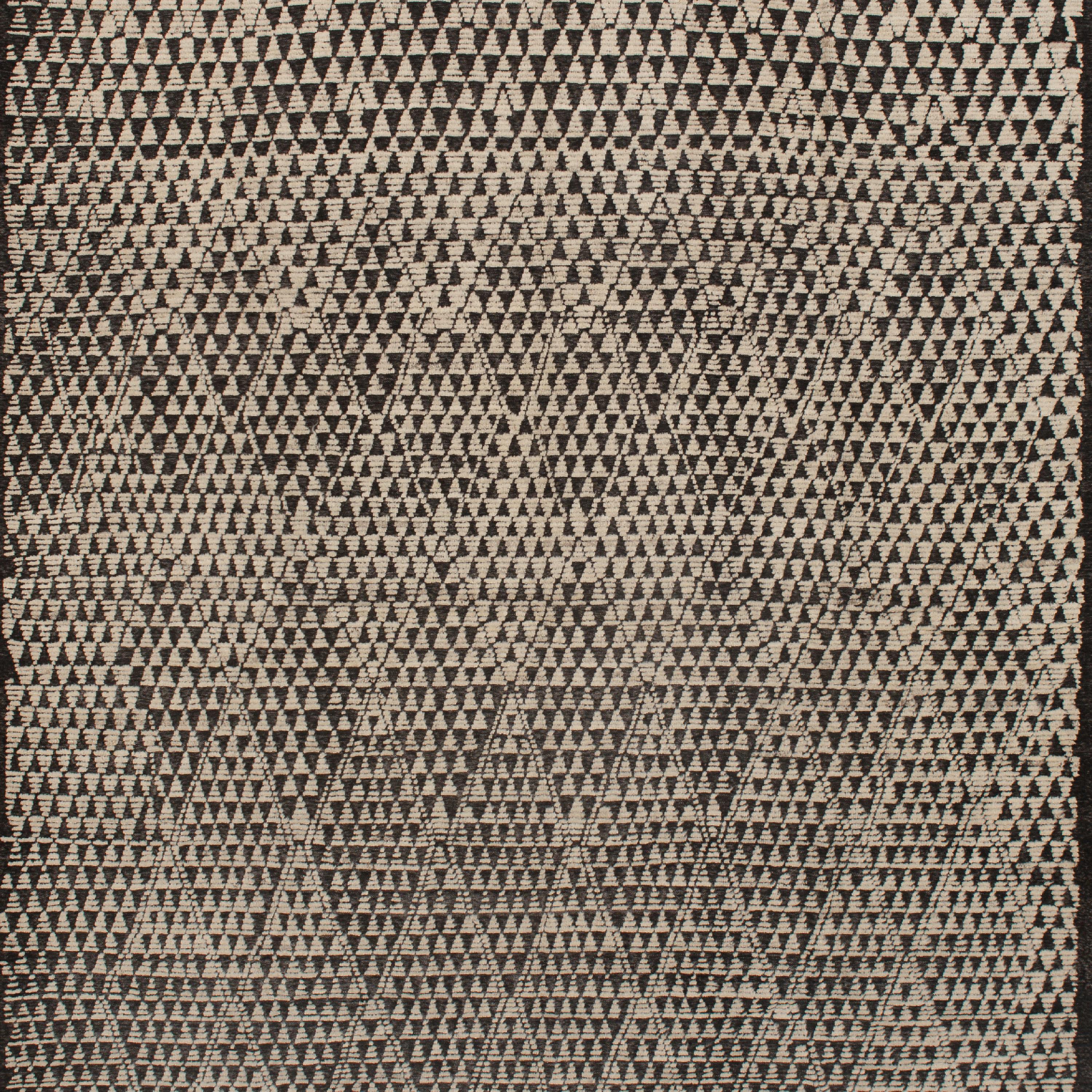 Inspired by the grounding foundations of Earth's natural colors and pure materials, this Zameen Black and White Geometric Wool Rug - 10'6
